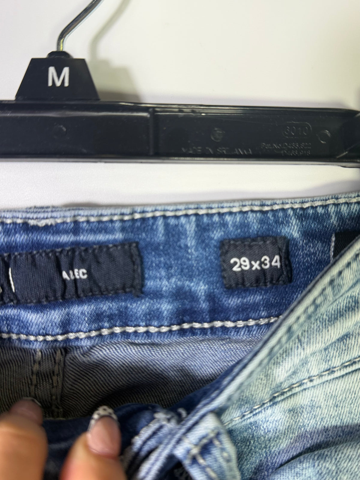 Light wash BKE Men's Tyler straight leg jeans in size 29x34, denim clothing with classic five-pocket design.