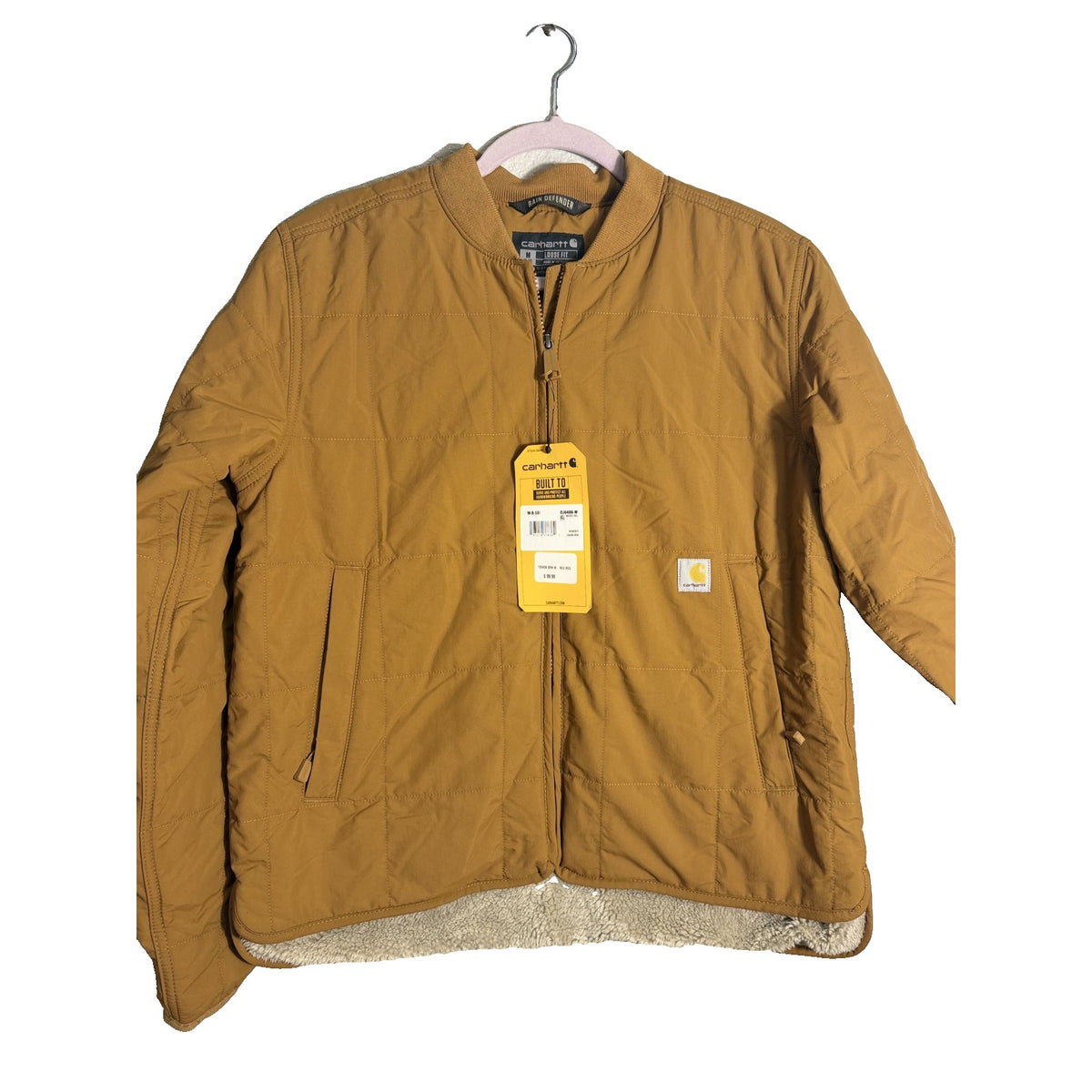 Carhartt Rain Defender loose fit quilted sherpa-lined women's brown jacket, size medium, showing front view with quilted interior.