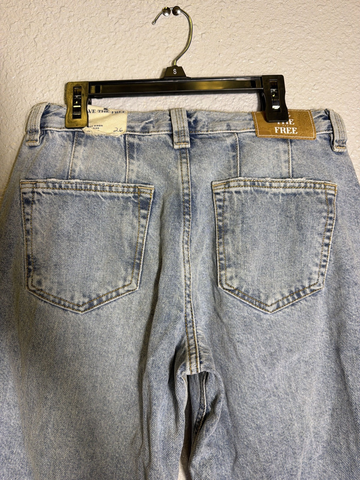Light wash We The Free Free People CRVY Siren Rise straight leg jeans for women, size 26, displayed on a model.