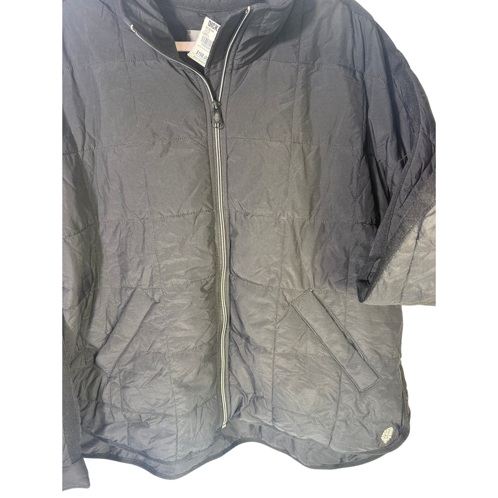 Black quilted Free People Movement women's full-zip jacket in size large, showing front view with quilted pattern and zipper closure.