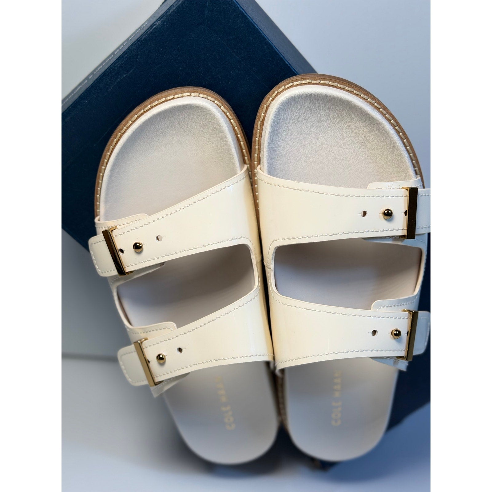 Cole Haan women's white leather buckle slide sandals, US size 9B, new in box with stylish open-toe design.