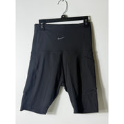 Nike women's black high-waisted training bike shorts, small size, close-up view of the fitted athletic shorts.