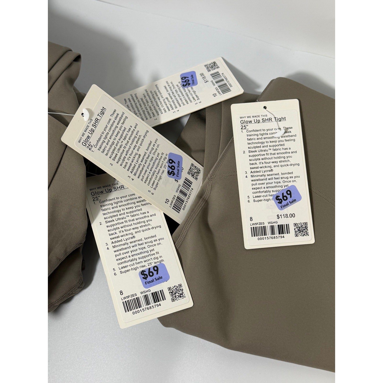 Lululemon Glow Up Super-High-Rise Leggings in Taupe Gray, size 8, showing the fitted high-rise design and stretchy fabric.