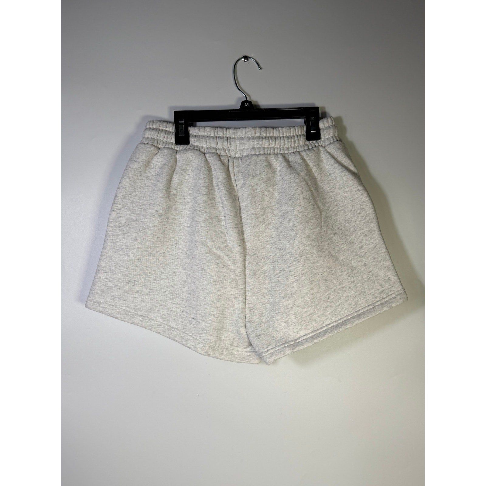 WILO women's fleece jog shorts in white marle, size M, with a relaxed fit and elastic waistband, displayed on a neutral background.