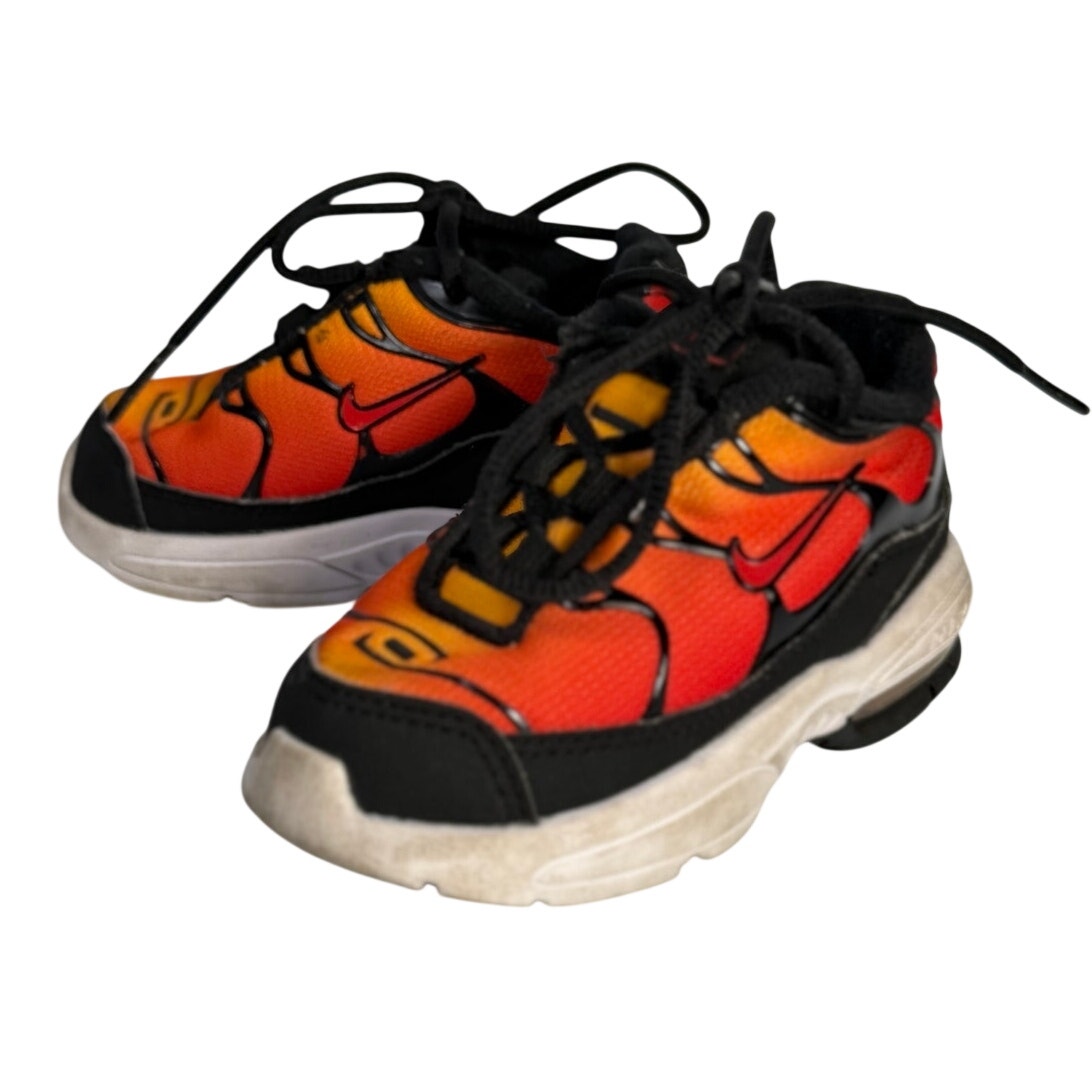 Pre-owned Nike Air Max athletic sneakers in orange, red, and black with lace-up design, size 5C.