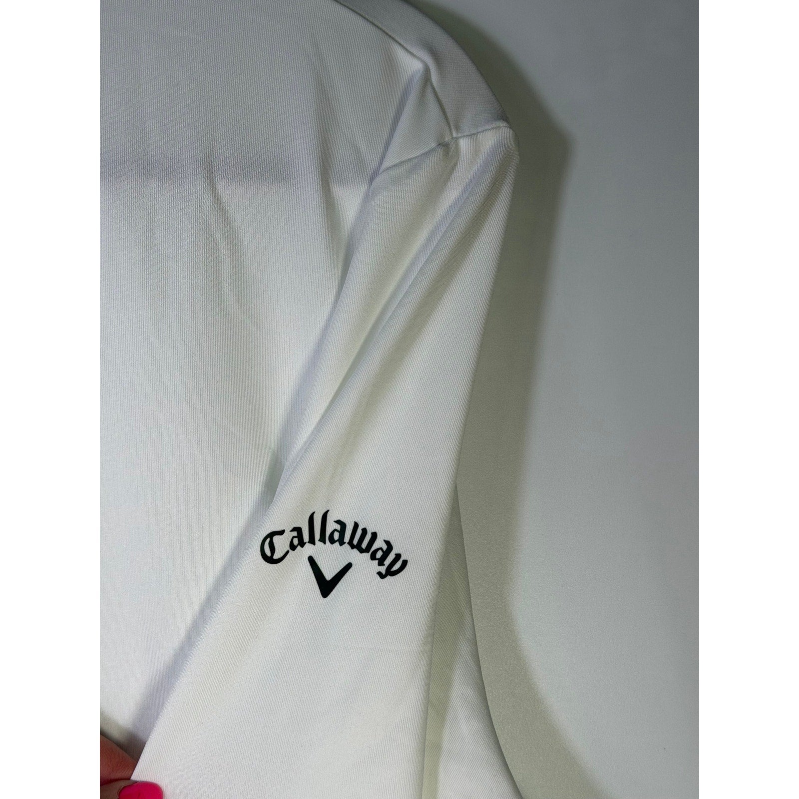Callaway women's white Opti-Dri quarter zip golf sweatshirt, size L, showing the comfortable design and fabric details.