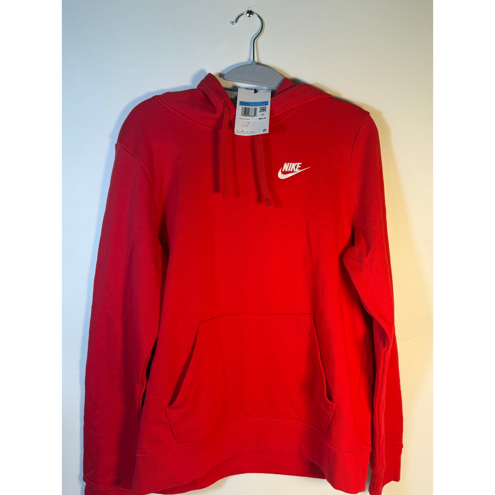 Nike Sportswear Club Fleece pullover hoodie in red, women's medium sweatshirt with a cozy fleece design and Nike logo.