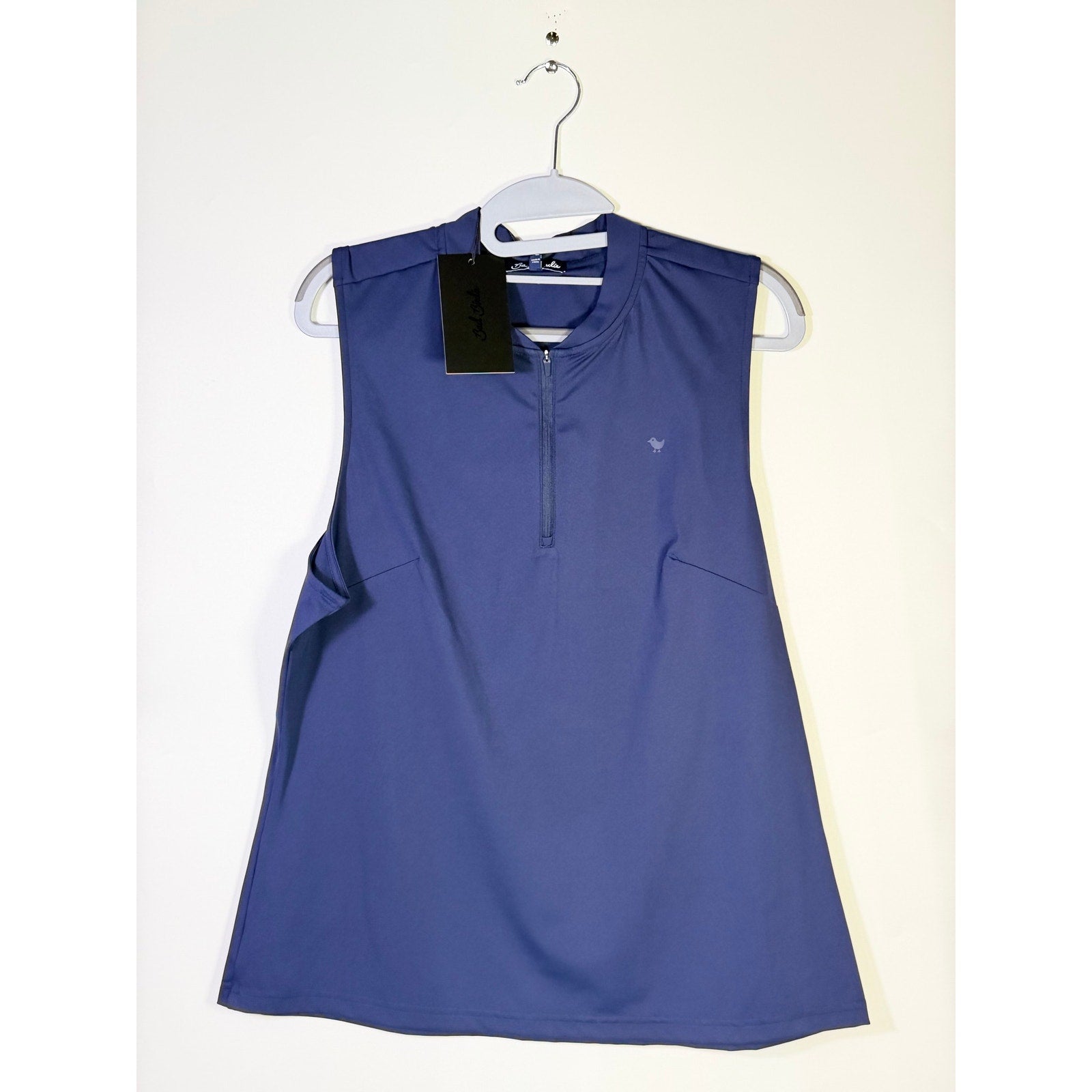 Bad Birdie women's blue sleeveless quarter-zip golf polo tank top, size XL, showcasing the stylish design and fabric texture.