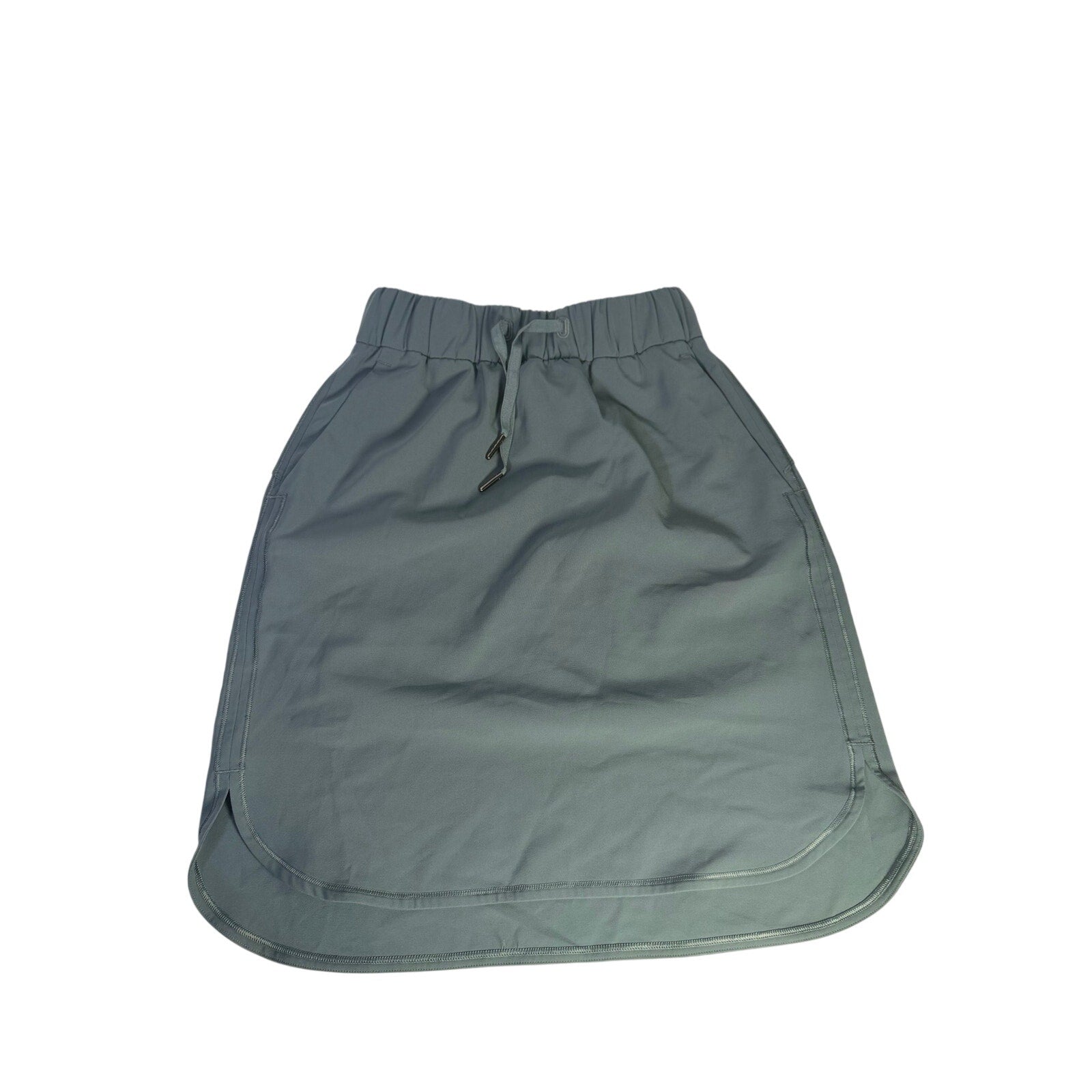 Lululemon women's sage gray pull-on athletic skirt, size 2, made of lightweight, stretchy fabric for active wear.