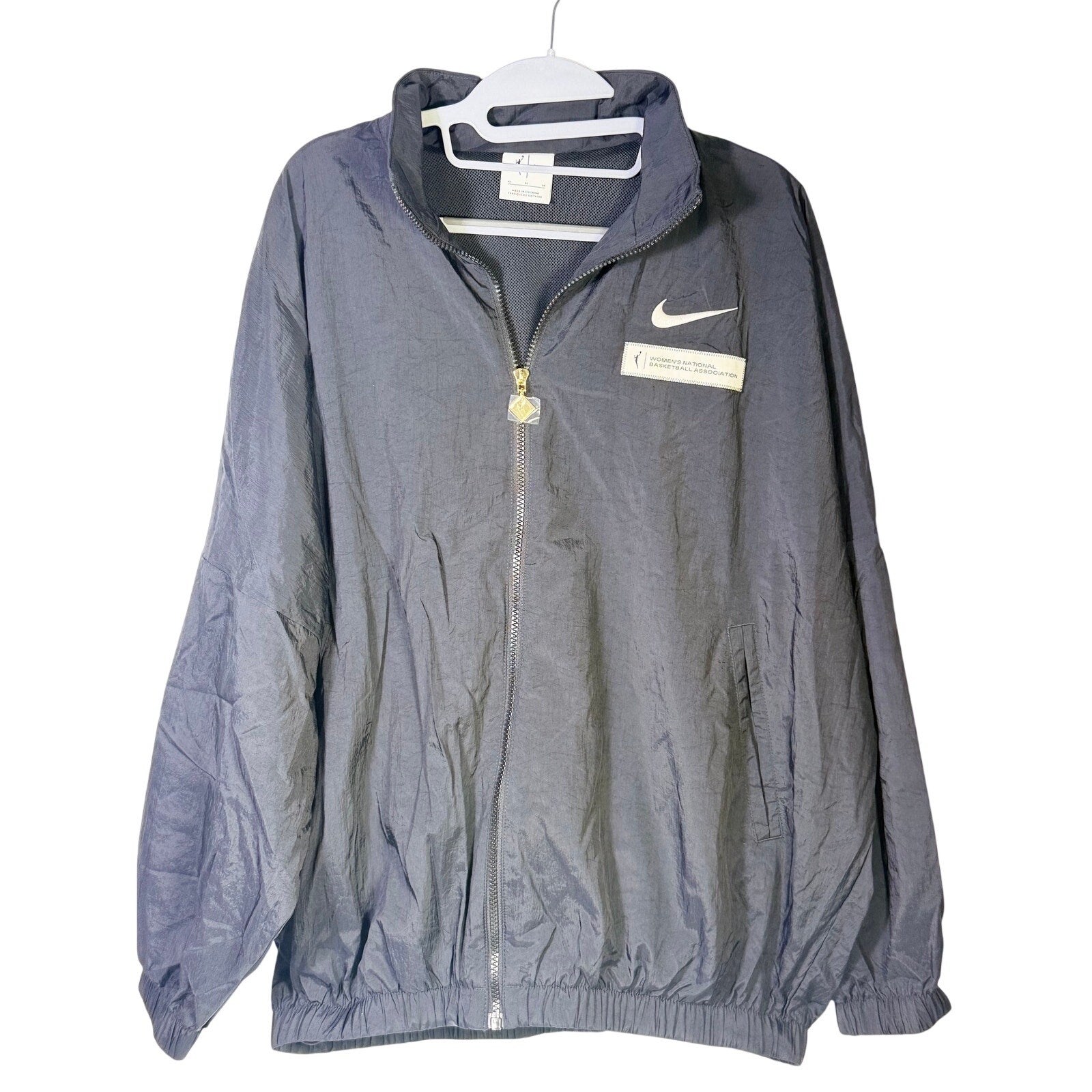 Nike women's WNBA windbreaker jacket in black, full zip, mesh-lined, size M, lightweight jacket with Nike branding.