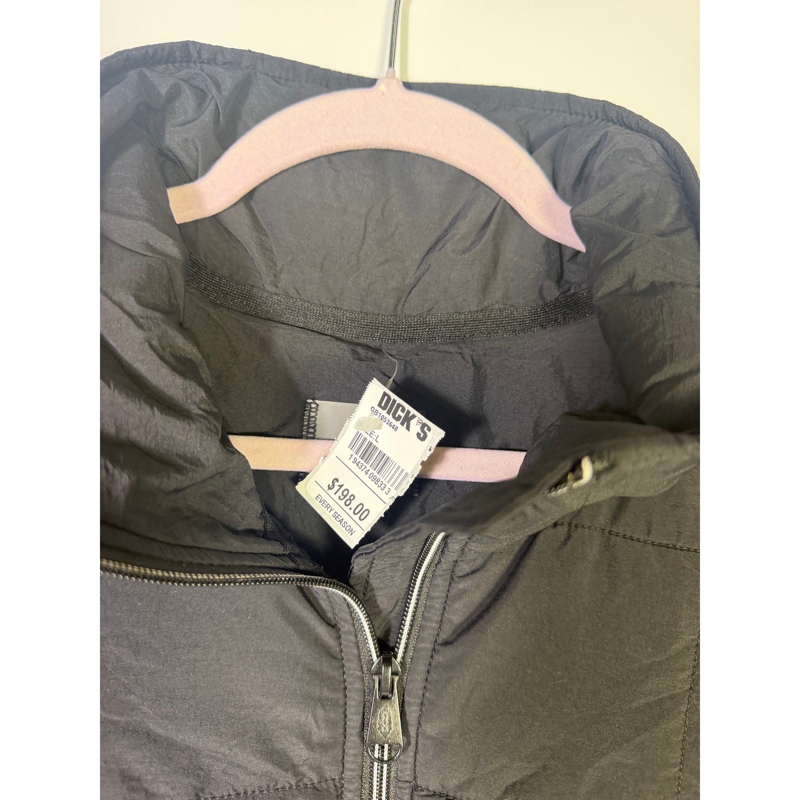 Black quilted Free People Movement women's full zip jacket, size large, shown flat with front view and quilted details.