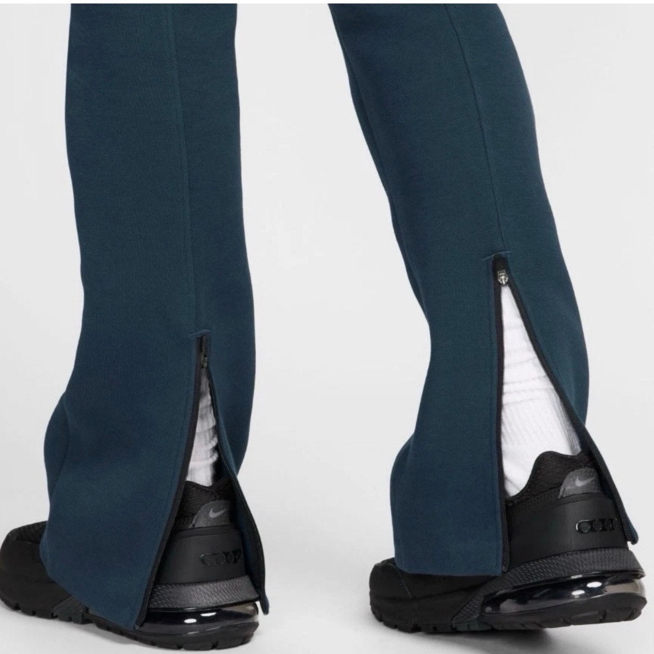 Nike Sportswear Tech Fleece high-waisted slim women's sweatpants in Armory Navy, shown laid flat with waistband and tapered legs.