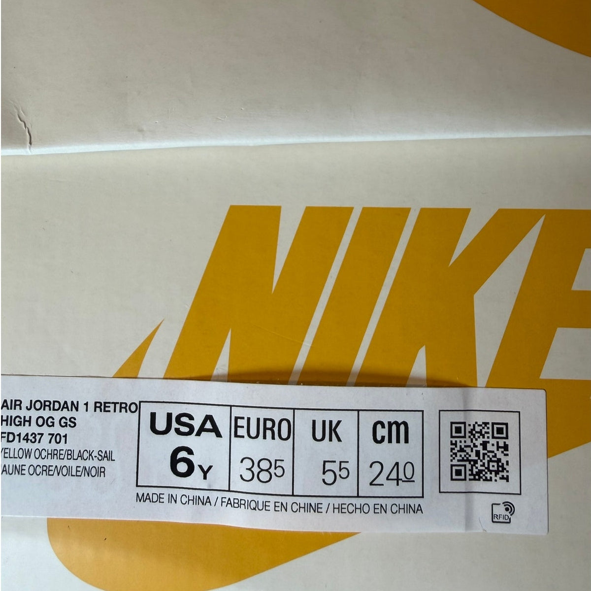 Nike Air Jordan 1 Retro High OG Yellow Ochre athletic shoes in grade school size 6Y, new in box, with yellow and black design details.