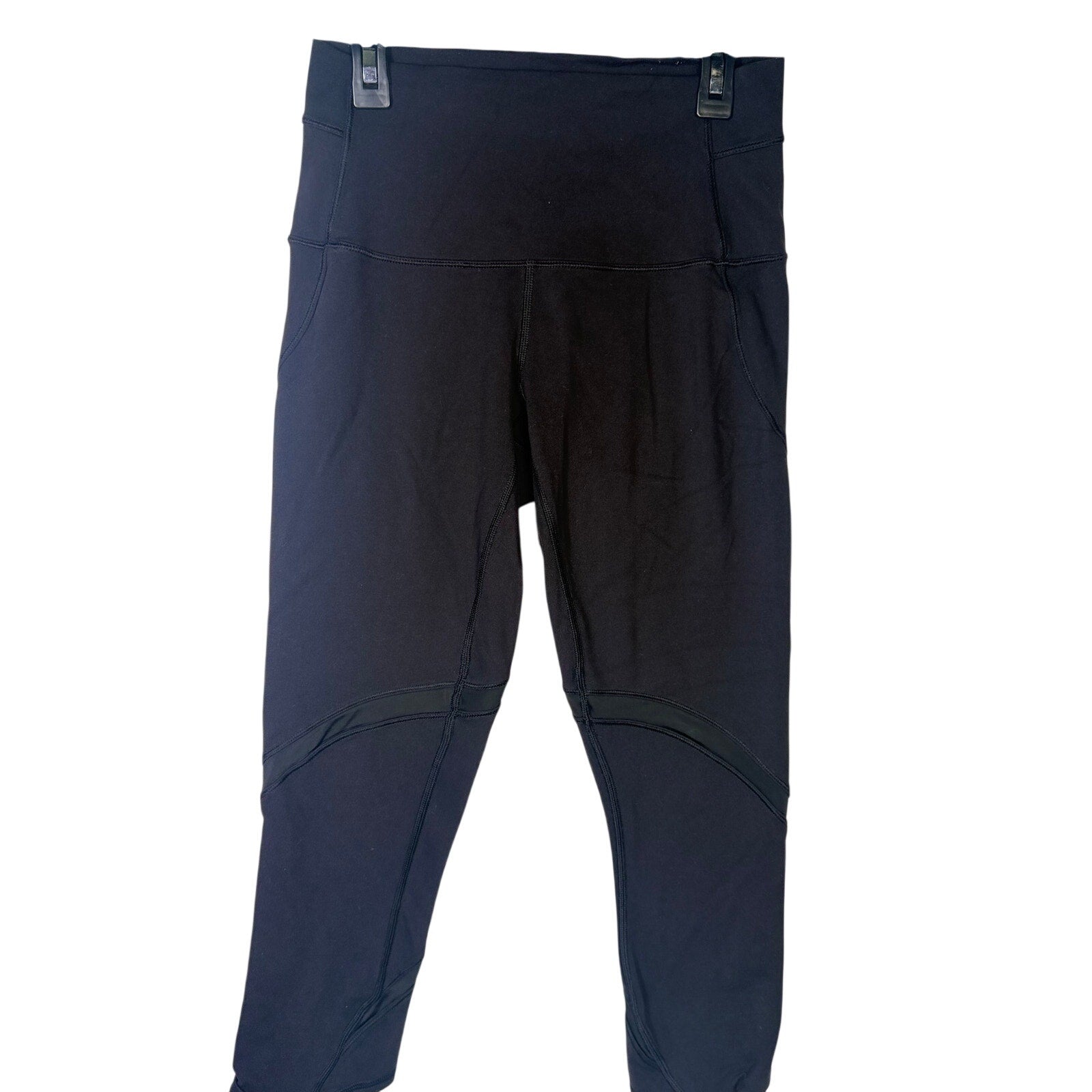 Lululemon women's high-rise paneled cropped leggings in black, size 6, featuring a fitted design and comfortable stretch fabric.