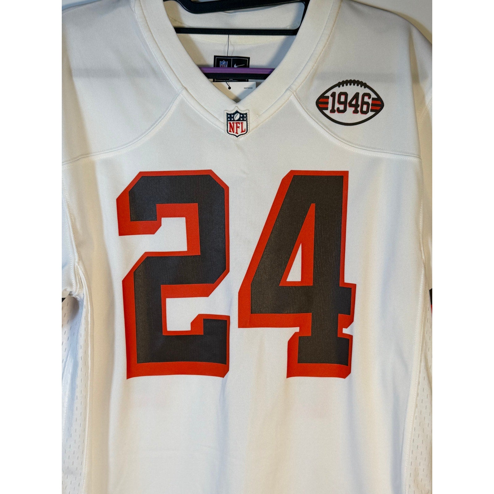 Nike Cleveland Browns #24 youth NFL white game jersey, size large (14-16), with team logo and player number visible.