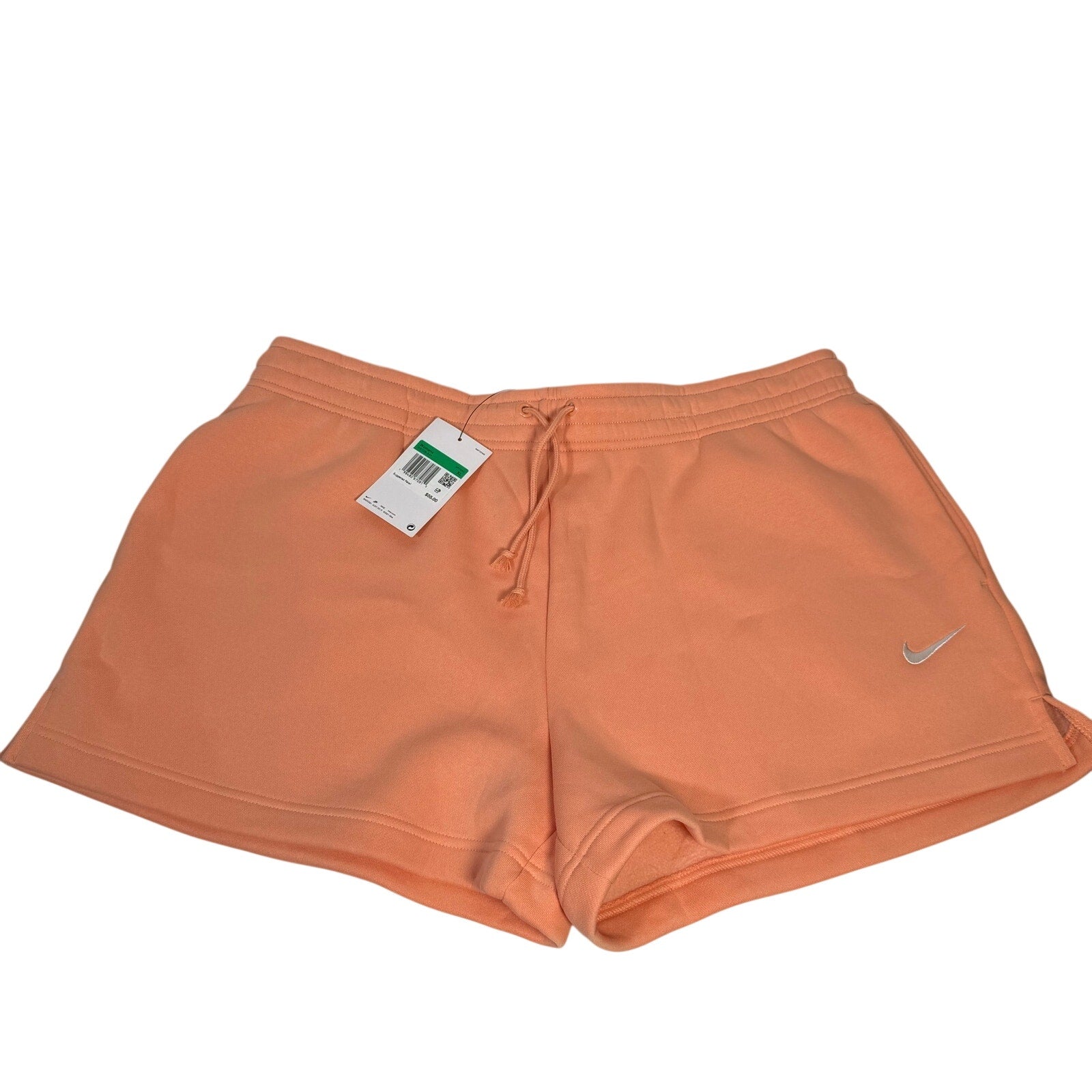 Nike women’s peach orange fleece drawstring shorts in size XL with elastic waistband and relaxed fit.