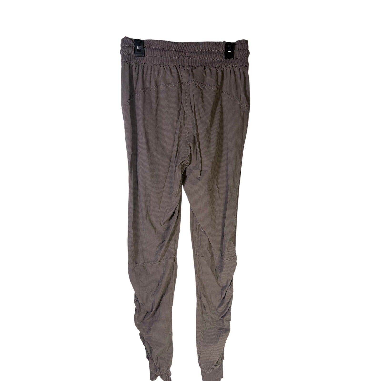 Lululemon women's taupe gray high-rise ruched tapered pants, size 4, preowned, shown laid flat on a neutral background.
