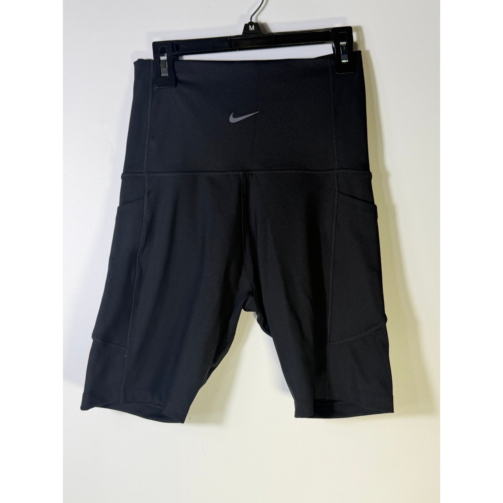 Nike women's black high-waisted training bike shorts, small size, shown flat on a white background.
