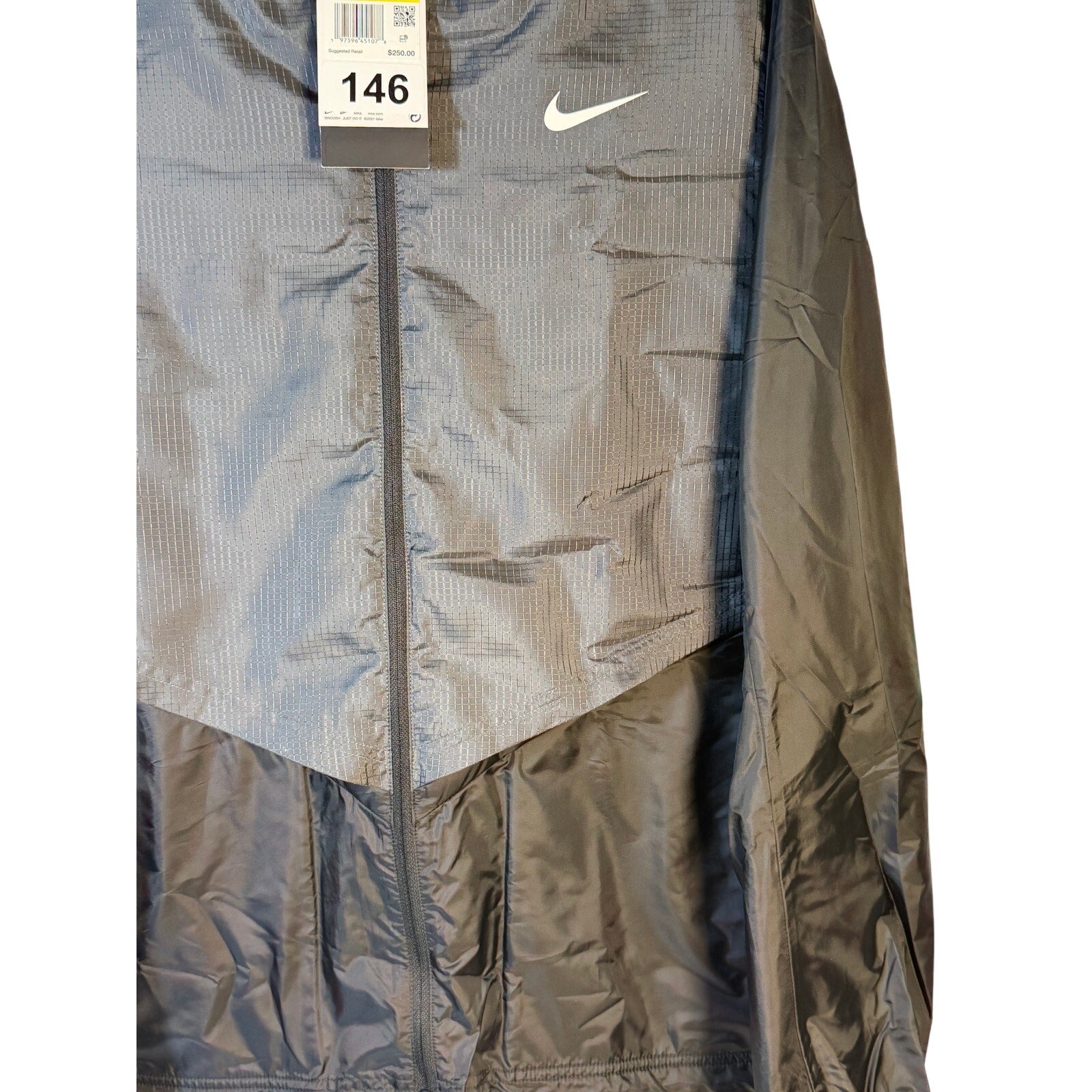 Nike Golf Therma-FIT Repel gray men's full-zip wind jacket, lightweight and warm, shown on a small-sized model.