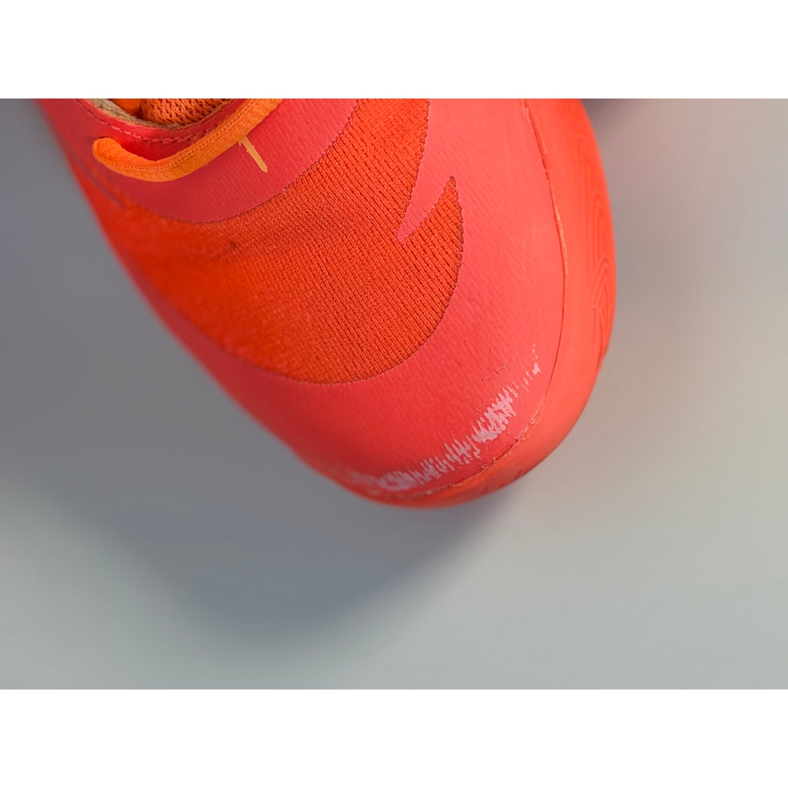 PUMA MB.02 Lo basketball shoes in orange and pink for men, size 5.5, athletic sneakers with stylish design.