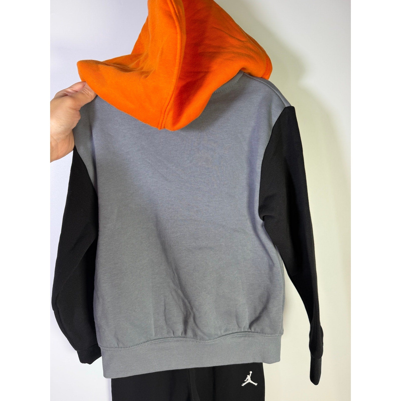 Jordan boys' 2-piece hoodie and jogger pants set in gray, black, and orange, size 4T, new with tags.