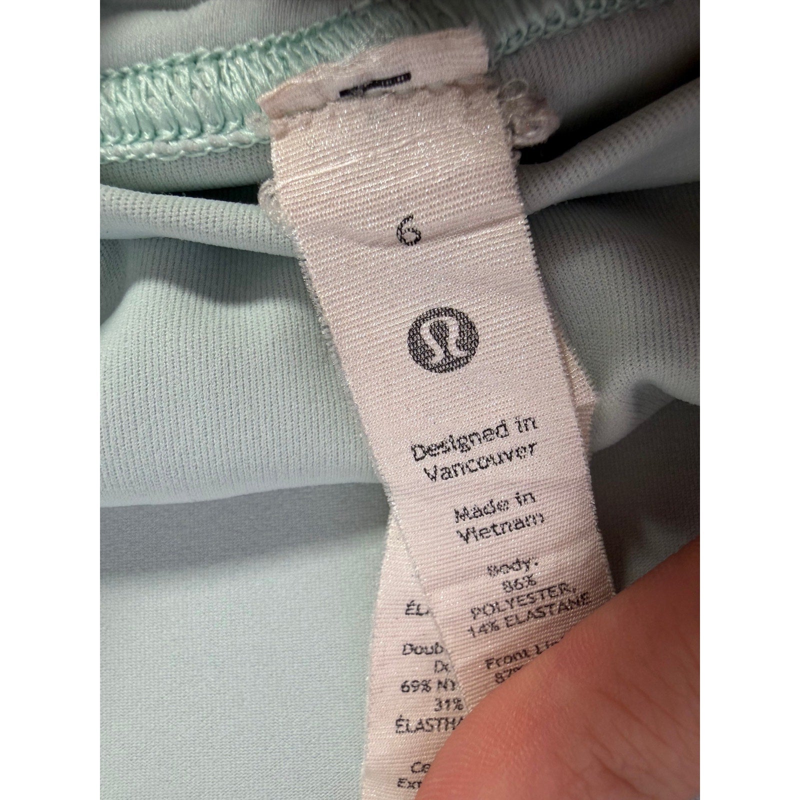 Lululemon women’s light mint pleated tennis skort with built-in shorts, size 6, featuring a stylish athletic design.