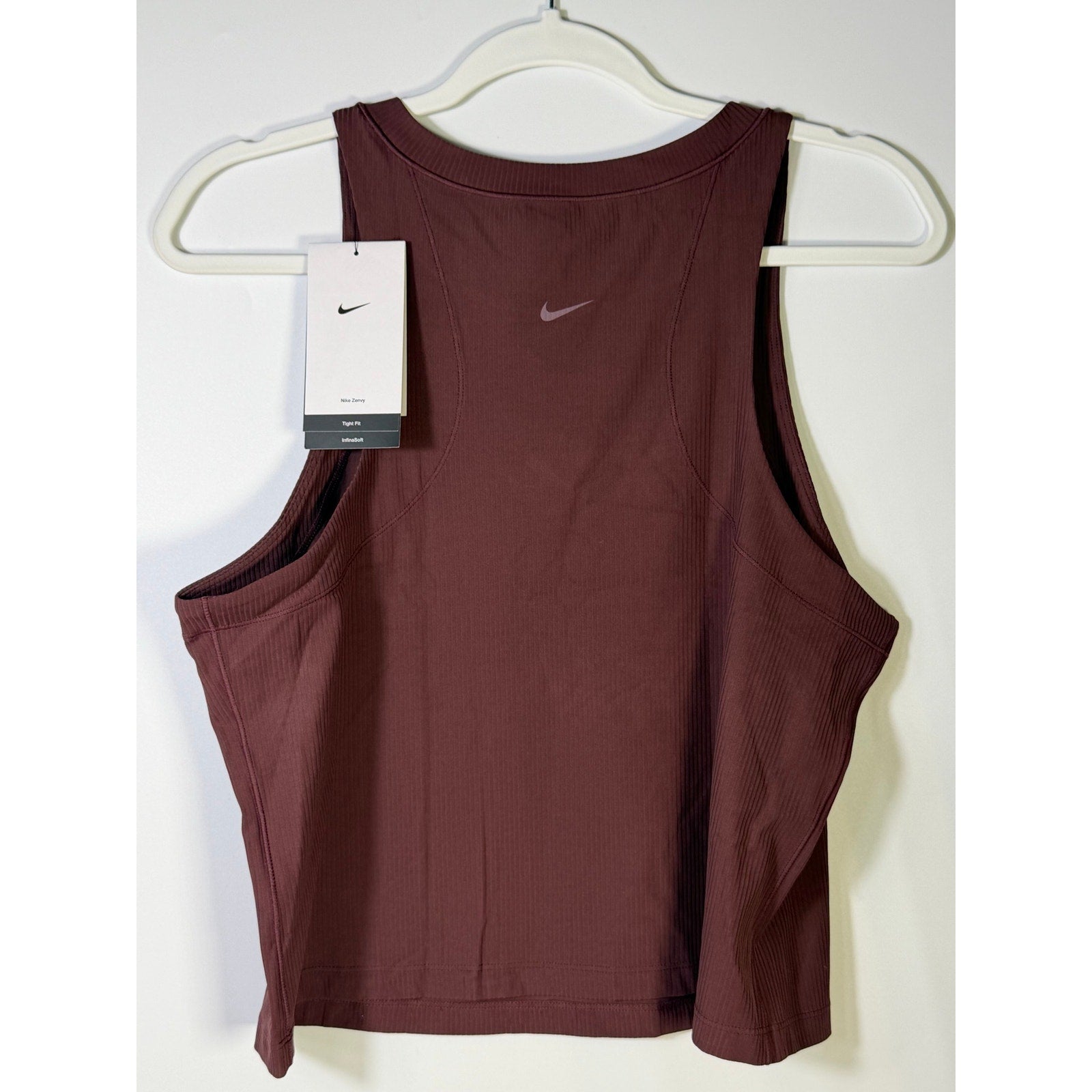 Nike women’s brown ribbed cropped muscle tank top, size L, new with tags, featuring a sleeveless design and athletic fit.