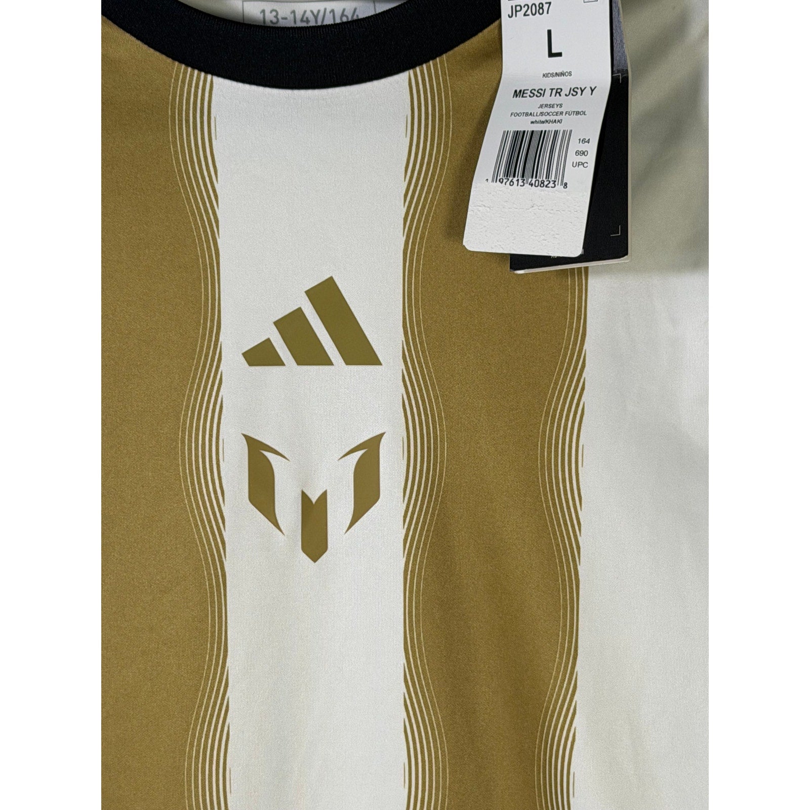Youth large Adidas Messi training soccer jersey in white and gold, featuring team and brand logos on the front.