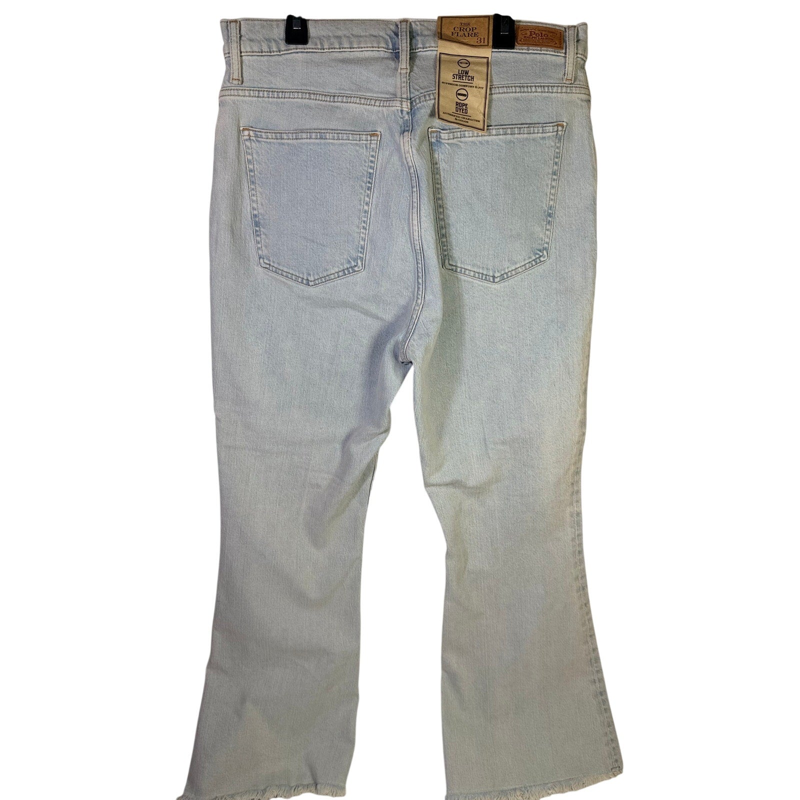 Light wash Polo Ralph Lauren women's crop flare jeans with raw hem, size 31, shown on a model.