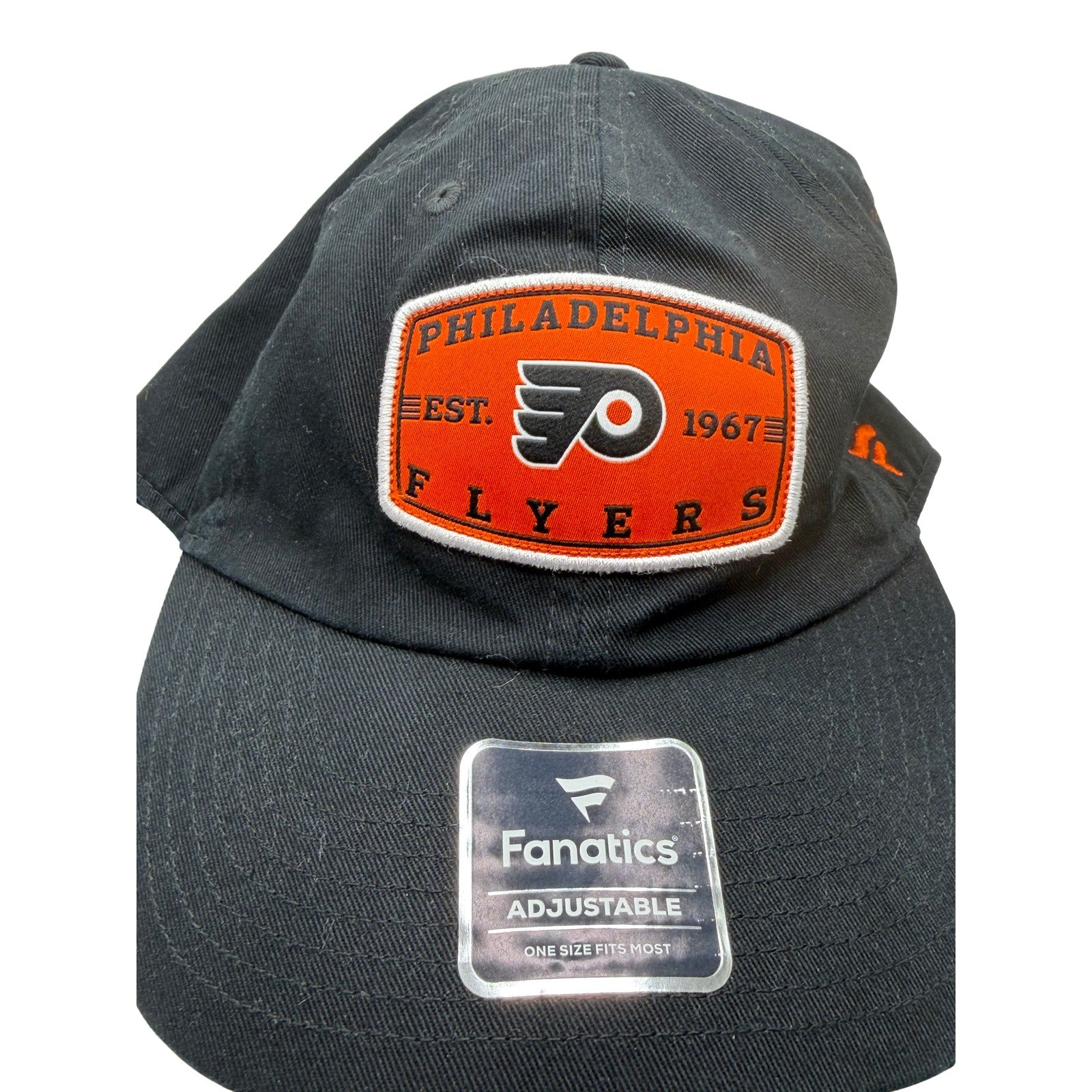Black adjustable NHL hat by Fanatics featuring Philadelphia Flyers logo, one size fits most, lightweight and comfortable.
