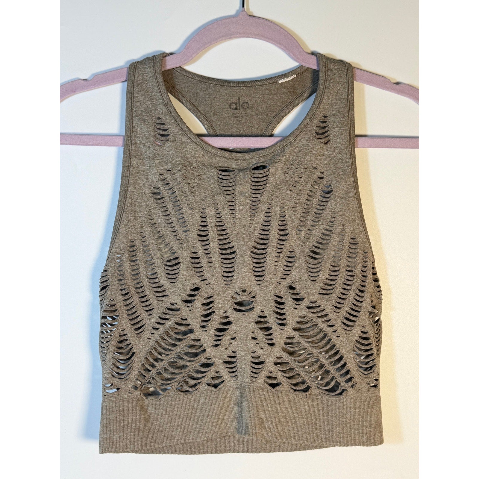 Gray Alo Yoga women's seamless open-knit racerback tank top, activewear style, lightweight and breathable for workout or casual wear.