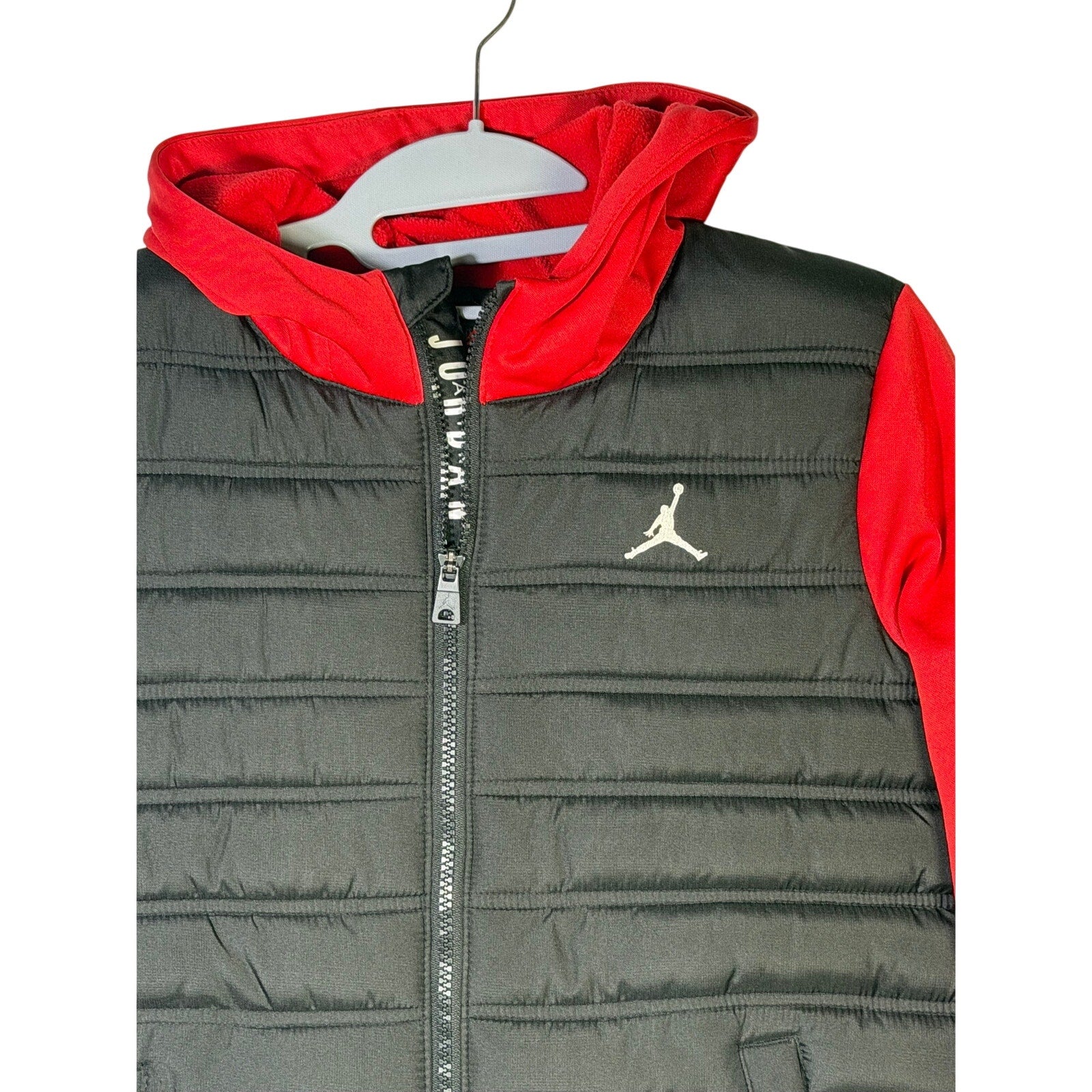 Jordan boys' black and red hybrid puffer jacket with hood, full zip, size M 10-12, lightweight and warm.