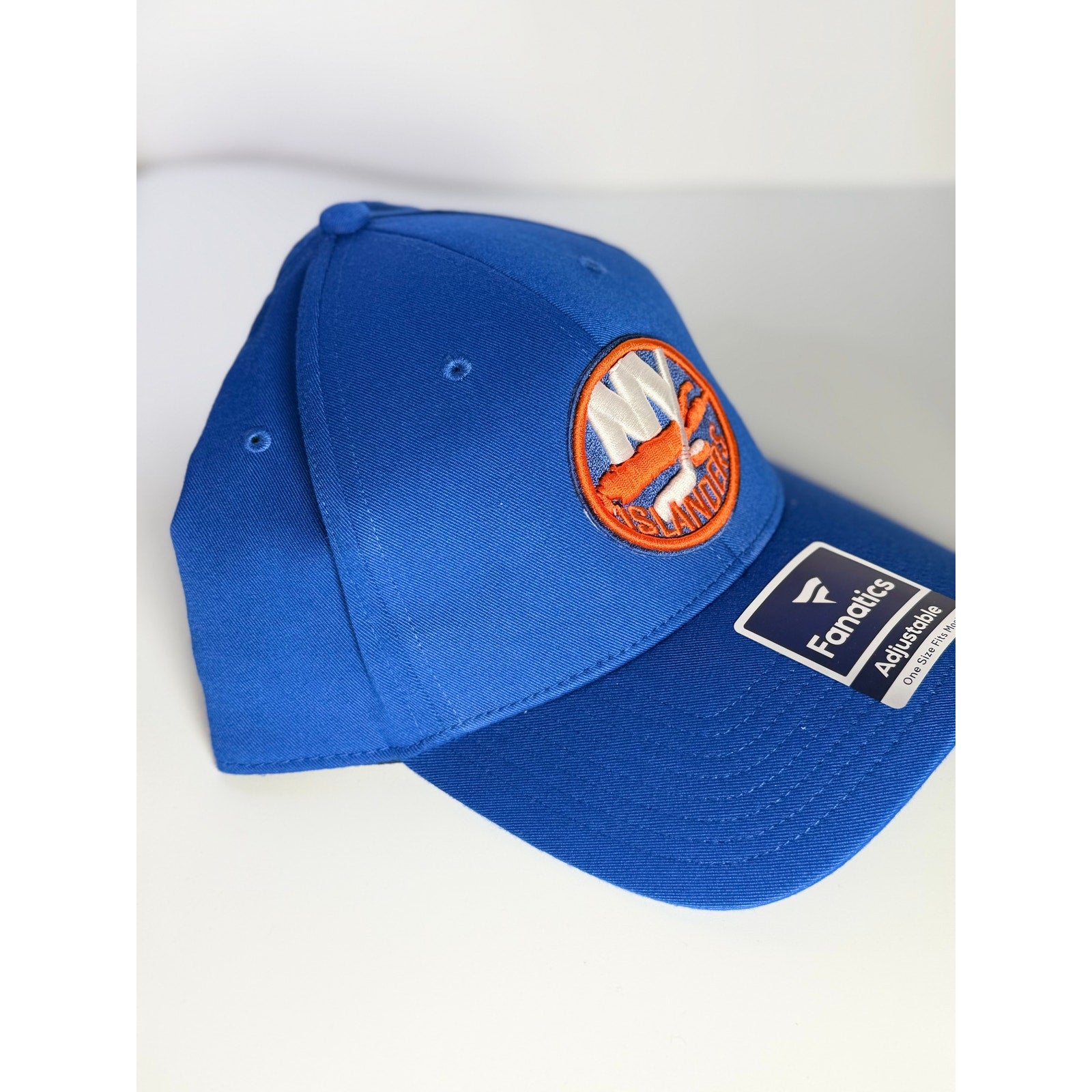 Fanatics New York Islanders adjustable blue NHL hockey cap with team logo and curved brim, front view.