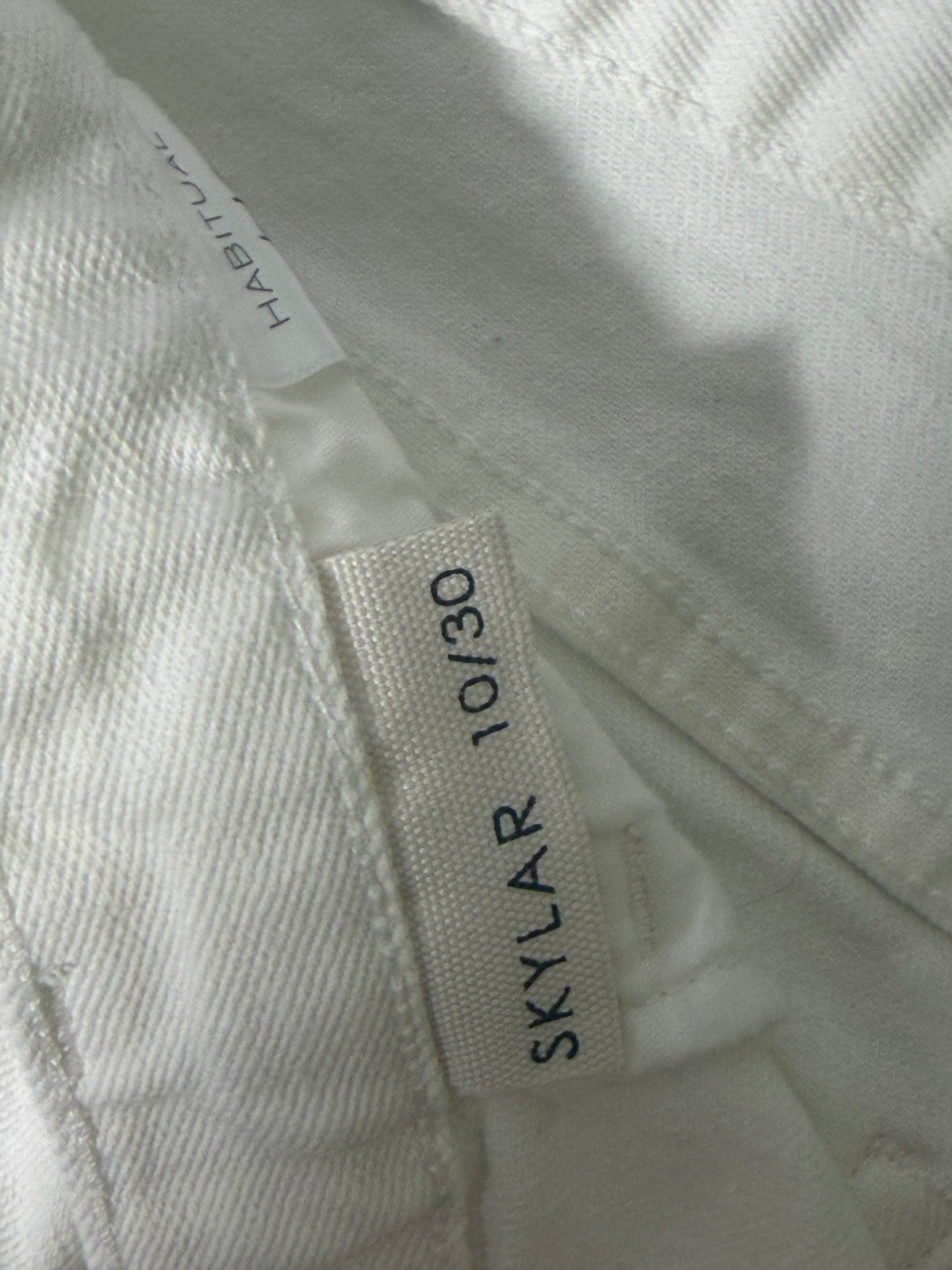 Habitual Skylar women's size 10/30 white denim Bermuda shorts with raw hem, casual clothing, laid flat on a white background.