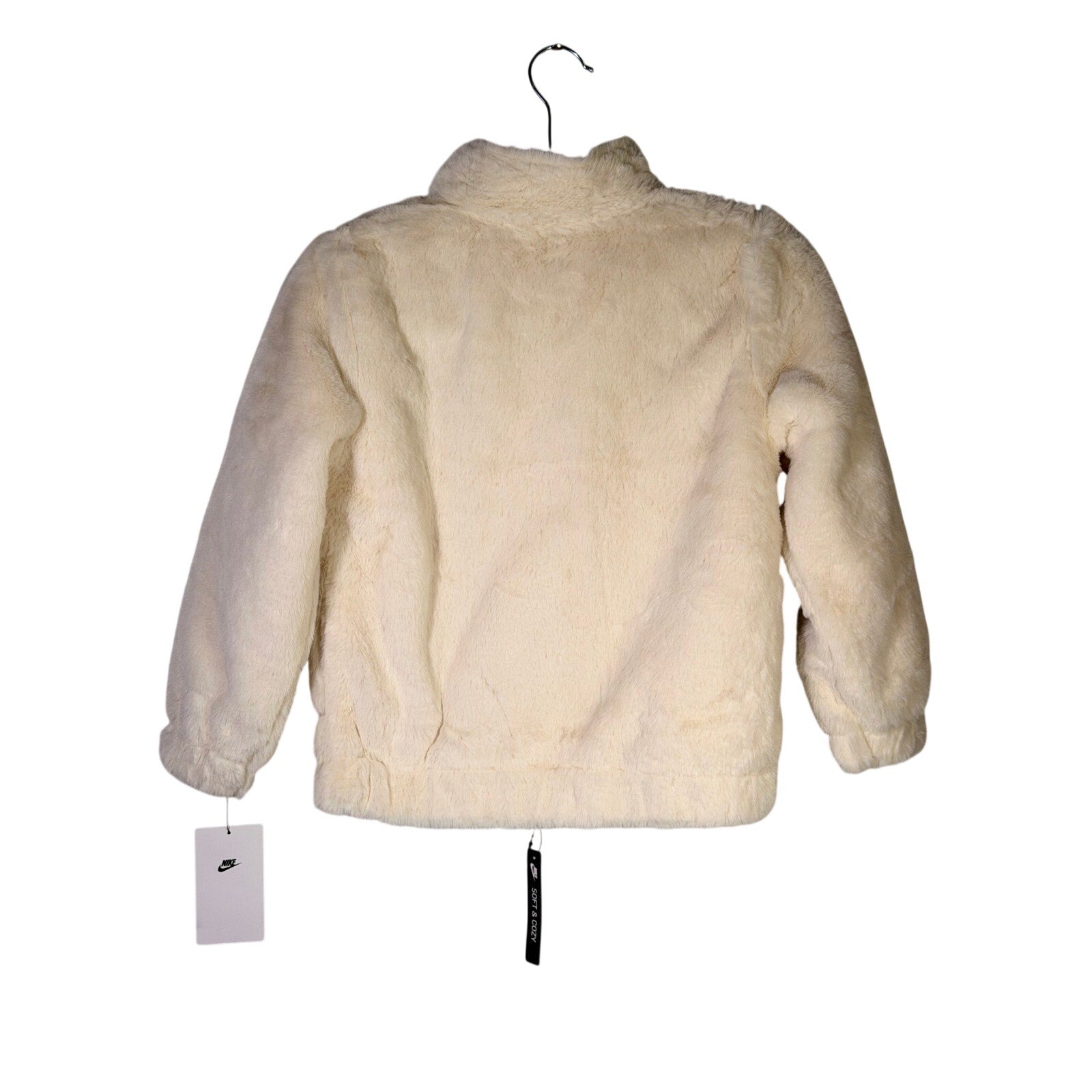 Nike girls' faux fur zip-up jacket in cream and black, size 6X, with oversized swoosh logo, new with tags.