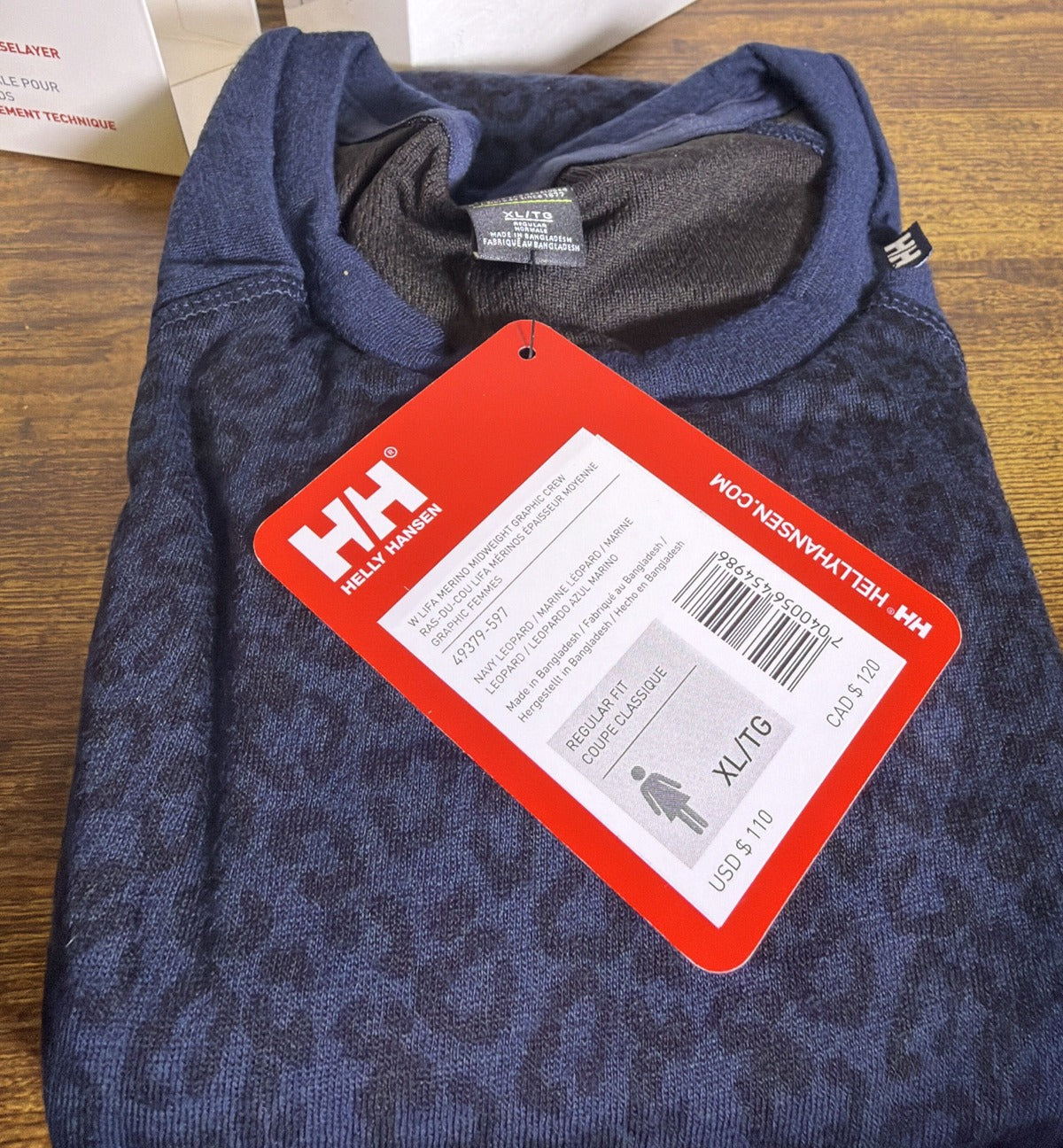 Helly Hansen women's Lifa Merino midweight graphic crew base layer shirt in navy leopard print, size large, front view.