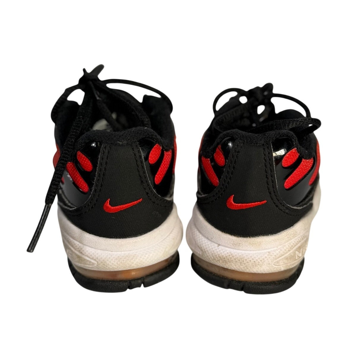 Pre-owned Nike Air Max athletic sneakers in orange, red, and black with lace-up design, size 5C, shown from a front view.