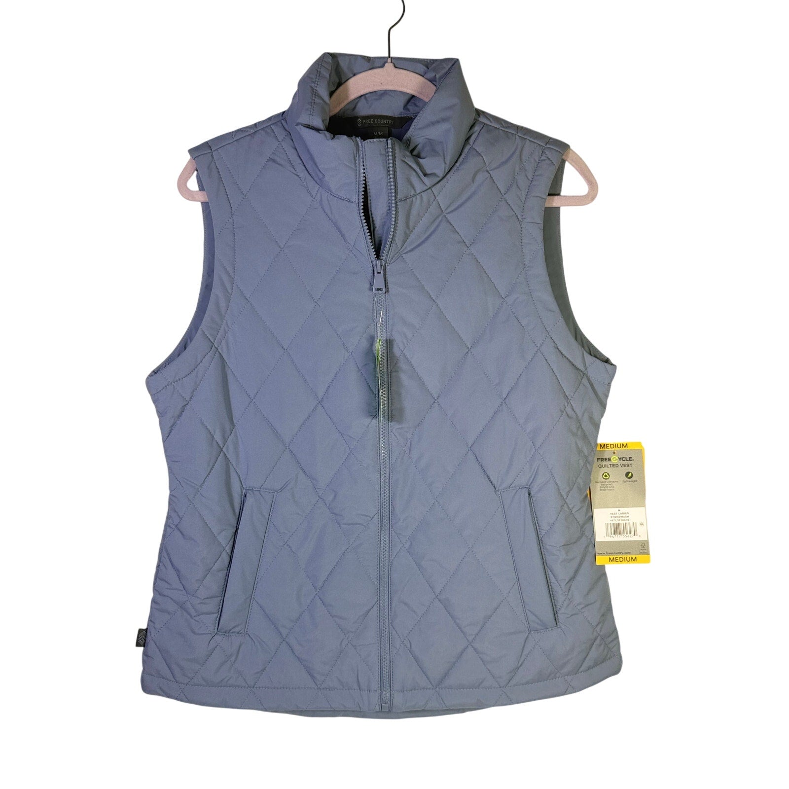 Women's Free Country FreeCycle quilted vest in stonewash blue, size M, with a warm, padded design and zip closure.