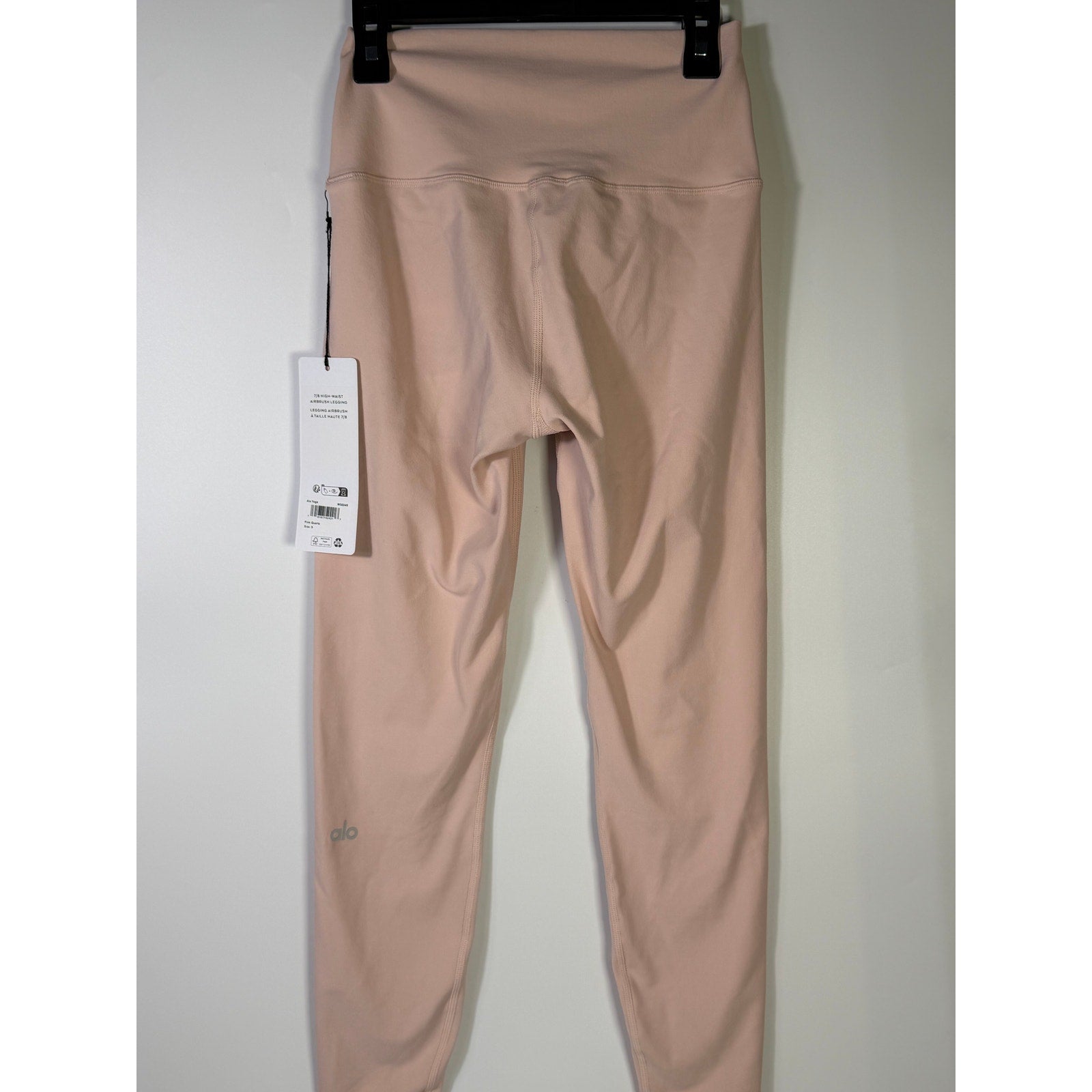 Pink Quartz Alo Yoga 7/8 high waist airbrush leggings for women, small size, shown laid flat with smooth fabric and comfortable fit.