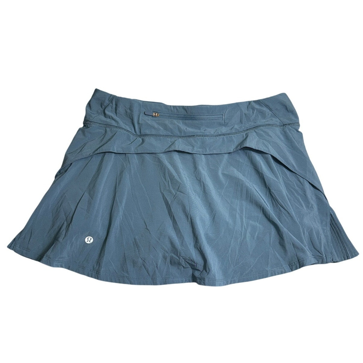 Lululemon Athletica women's ruffle pleated skirt in size 8 with back pocket, showcasing the stylish design and fabric details.