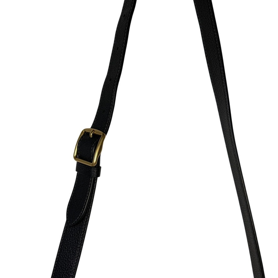 Coach women's black pebbled leather crossbody handbag with gold-tone hardware, featuring a sleek shoulder strap and structured design.