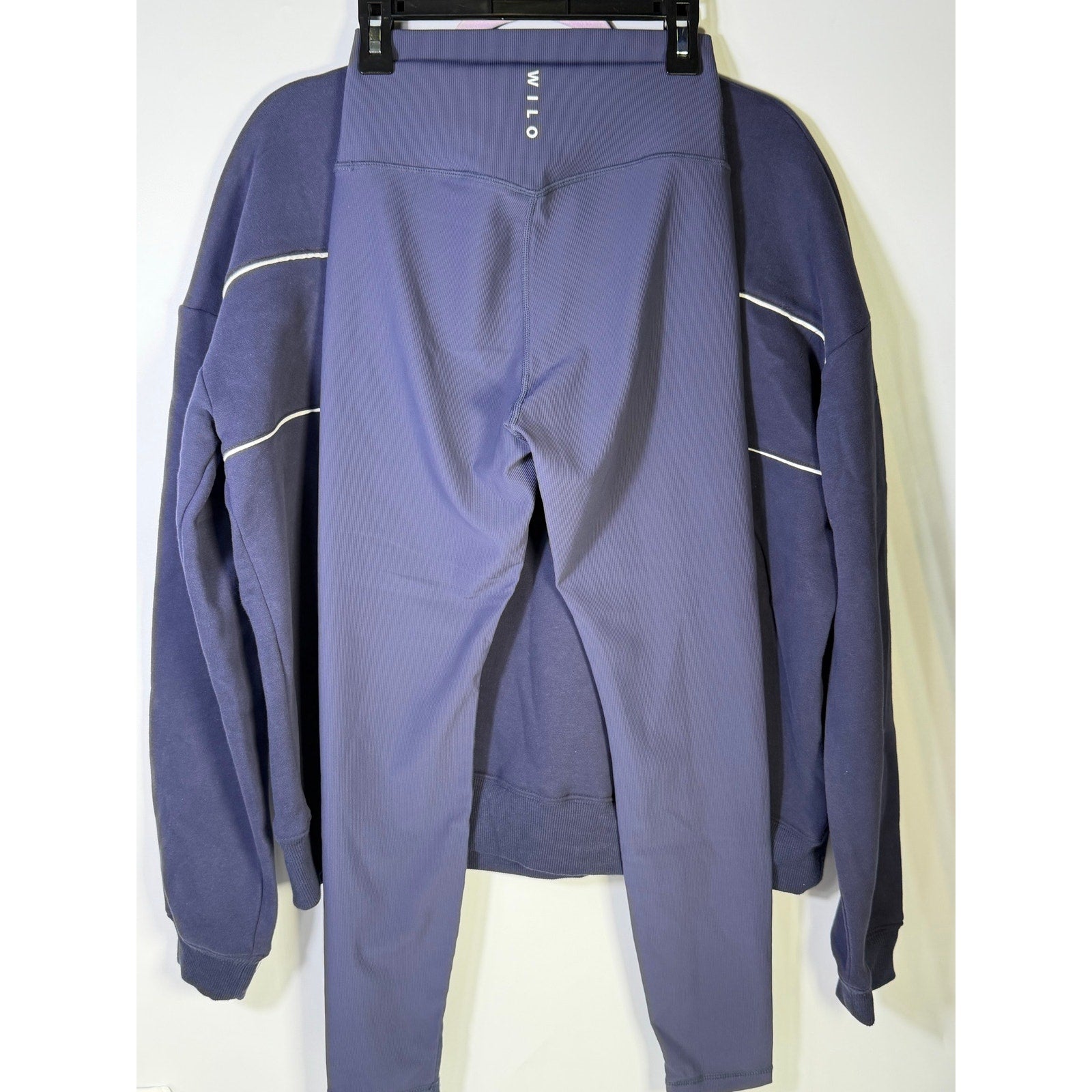 Wilo women’s navy 2-piece sweatshirt and leggings set, size small, featuring comfortable matching leggings and sweatshirt.