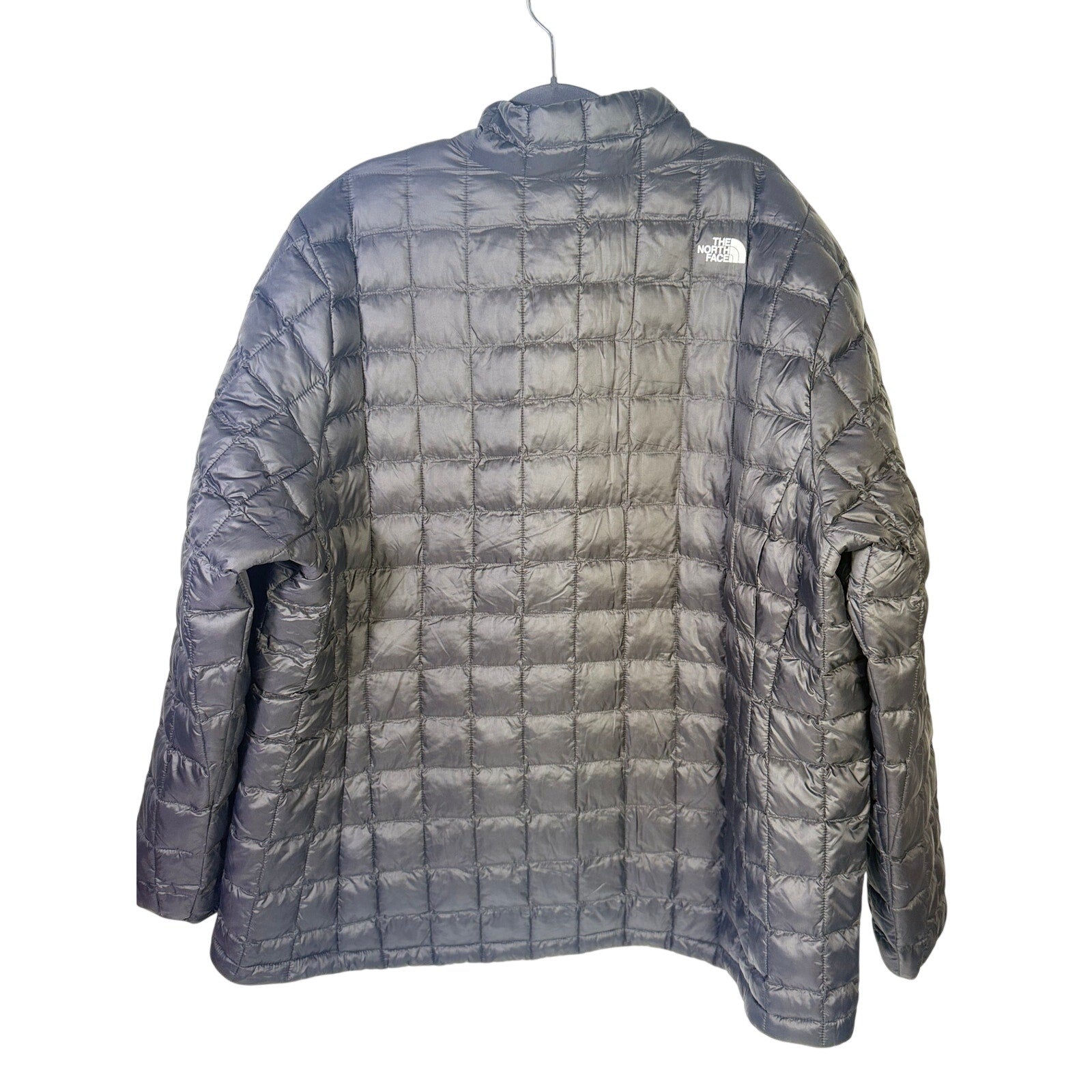 The North Face Women’s Plus ThermoBall Eco Jacket in black, size 3X tall, shown from the front with a quilted design and full zipper.