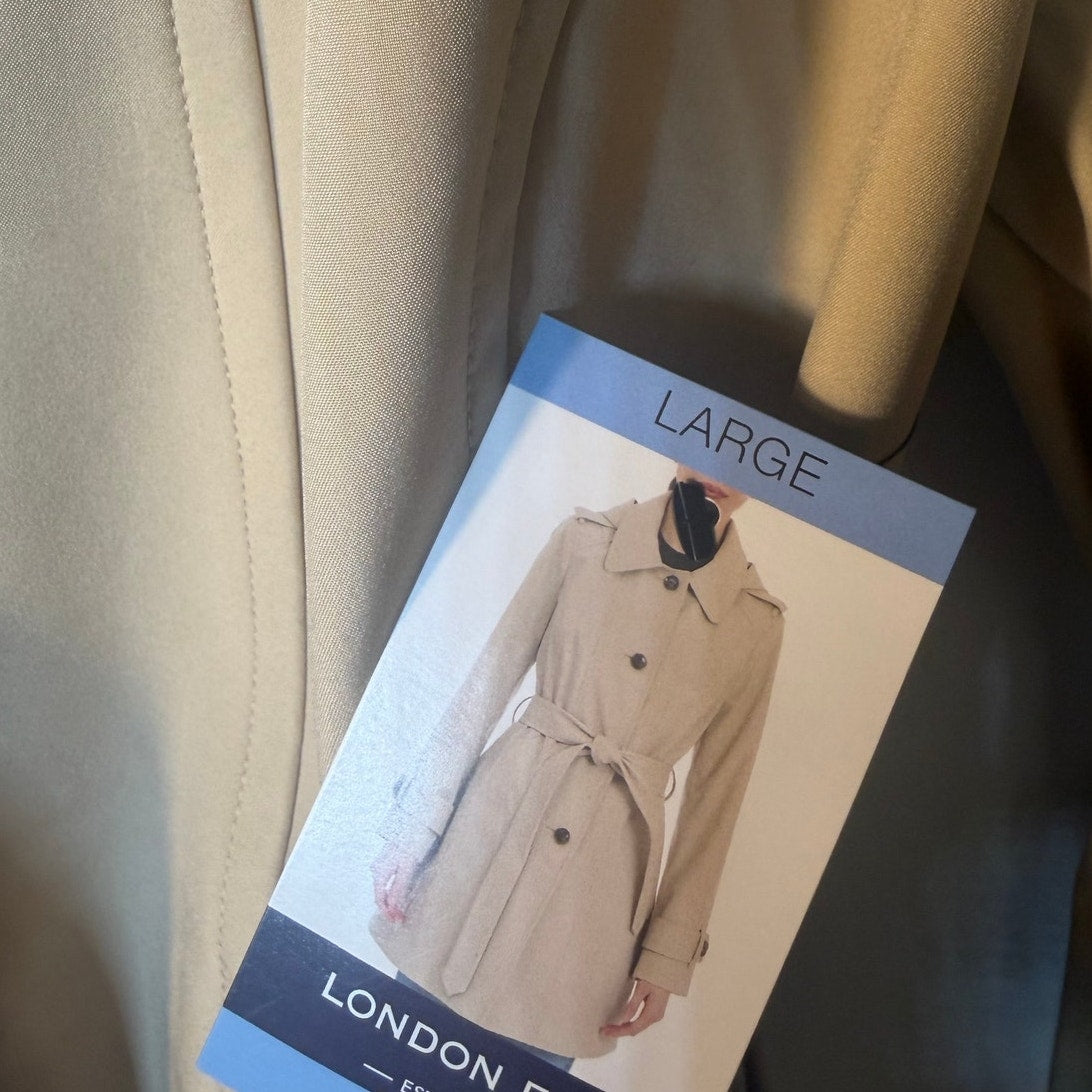 London Fog women's double lapel trench coat in size large, navy blue, showcasing classic style and tailored fit.
