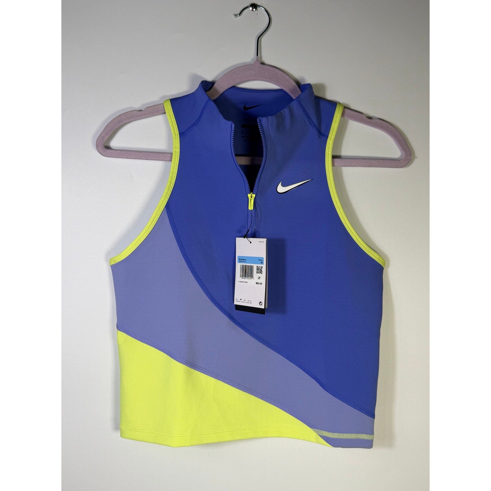Nike women's sleeveless quarter-zip crop top in blue lime, size M, showing the vibrant color and sleeveless design.