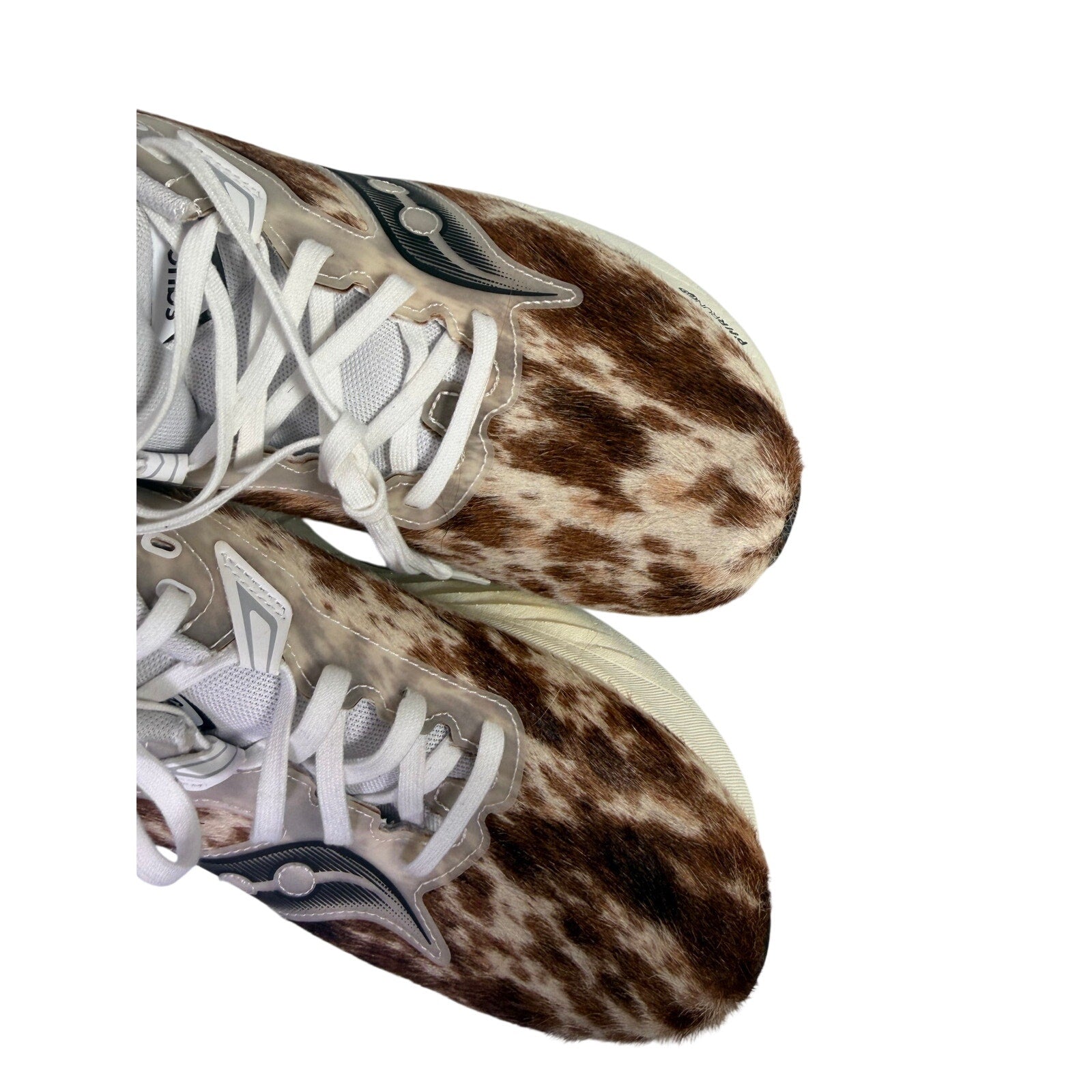 Saucony Women’s Endorphin Shift 3 Runshield cow print athletic running shoes, size 9, with black and white design and cushioning.