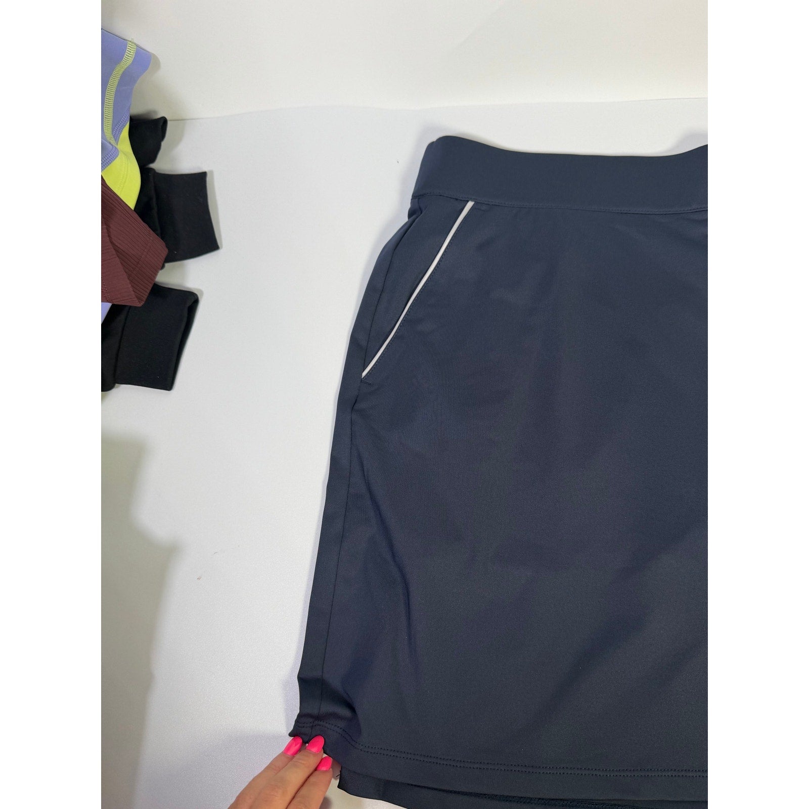 Dunning women's navy golf skort with built-in shorts, athletic skirt design, size large, featuring a comfortable, sporty look.