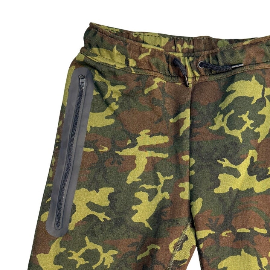 Nike Sportswear Tech Camo jogger pants for youth large, slim fit, with camouflage pattern and athletic style.
