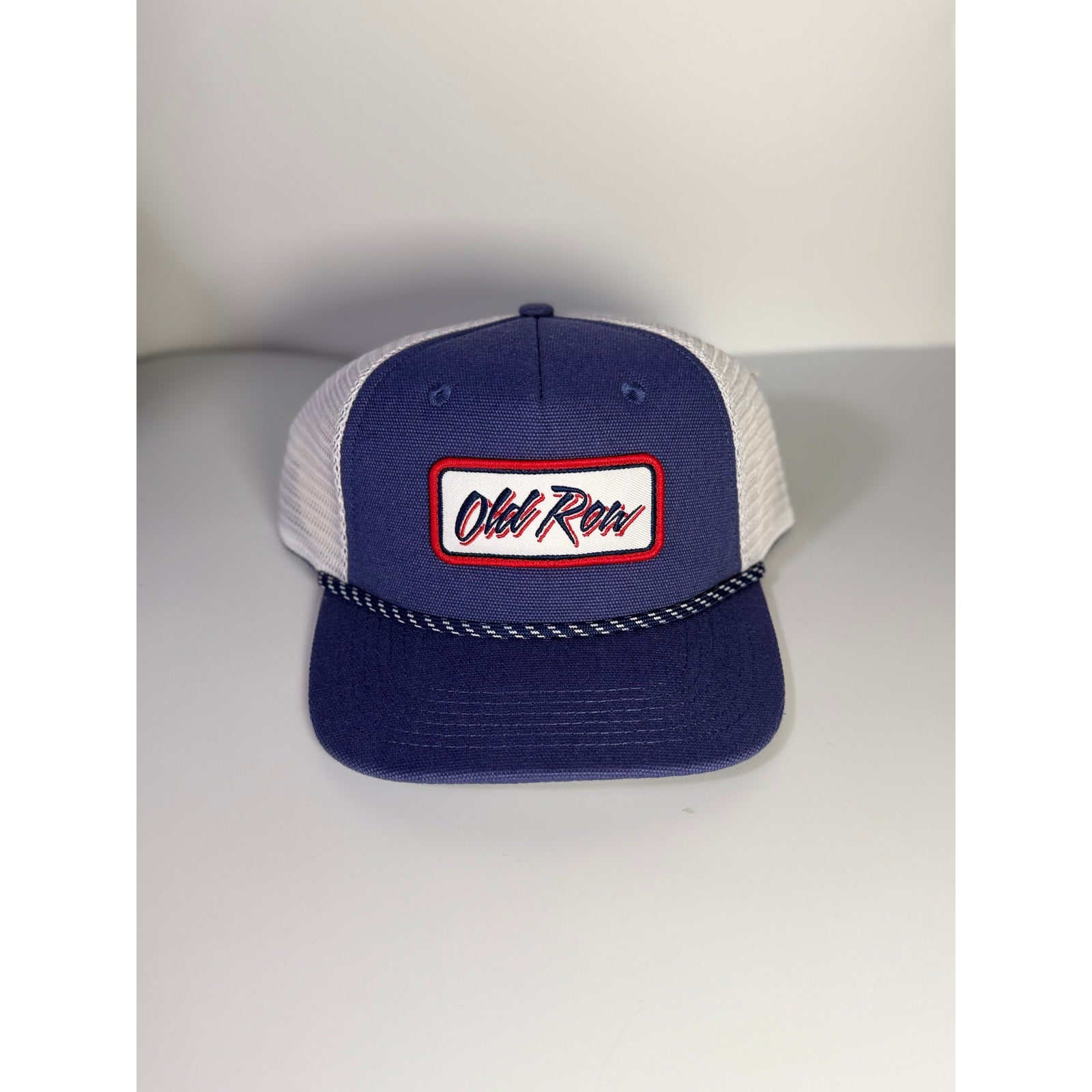 Old Row navy and white trucker hat with mesh panels, rope detail, snapback closure, adult size, unisex style.