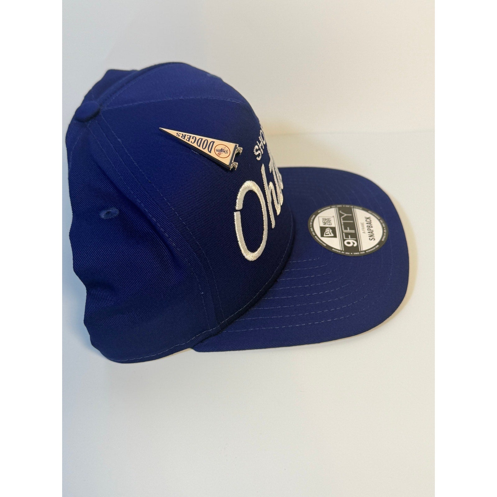 New Era 9FIFTY Shohei Ohtani Dodgers snapback hat in blue, featuring Dodgers logo and adjustable A-frame design.